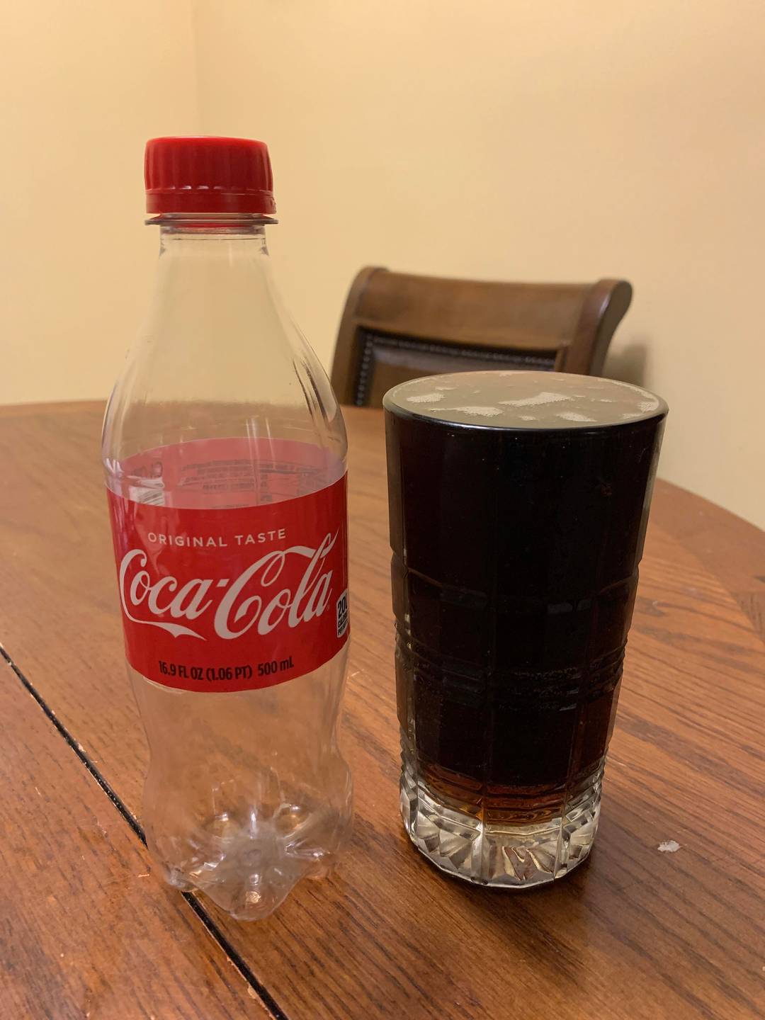 This bottle of Coke a filled this cup perfectly