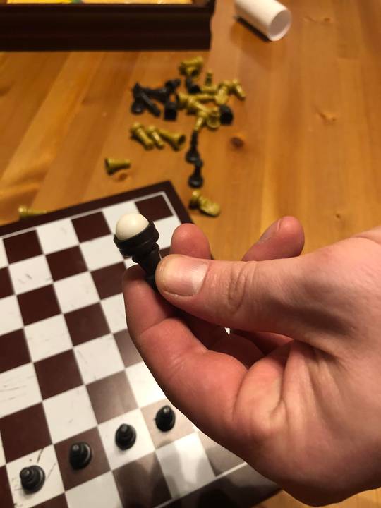 This game set includes Chinese checkers pieces that perfectly get stuck inside the chess pieces.