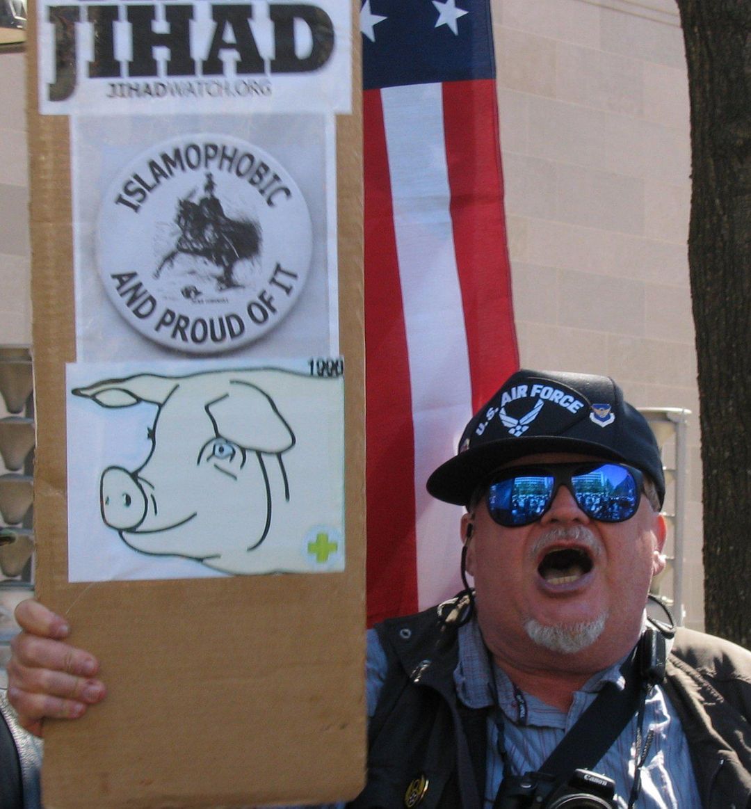 This guy at an anti-Islam rally. I'm not sure where his chin ends and his neck begins.
