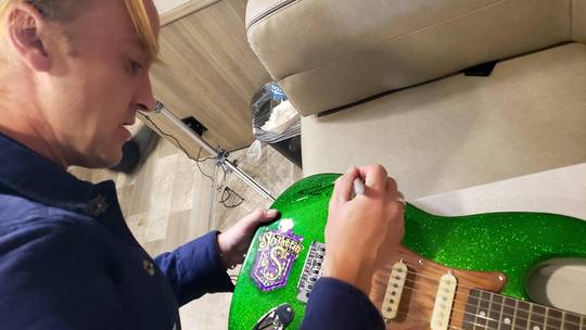 Tom Felton signed a Slytherin guitar I made!