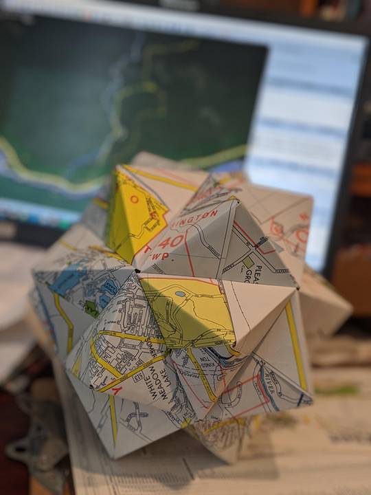 Triambic icosahedron made from old maps