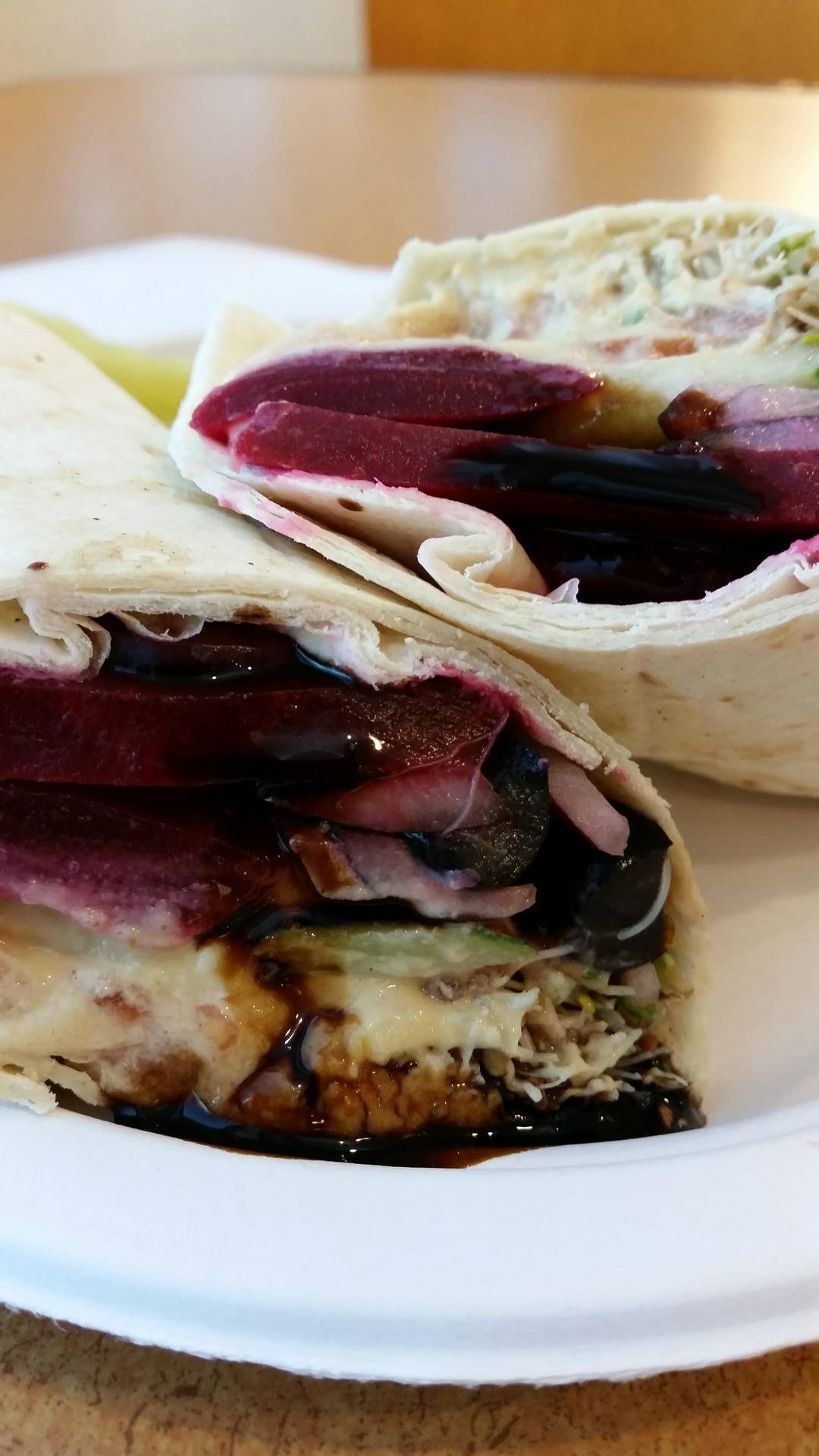 Veggie wrap with hummus, beetroot, and balsamic reduction. (X post r/eatsandwiches)