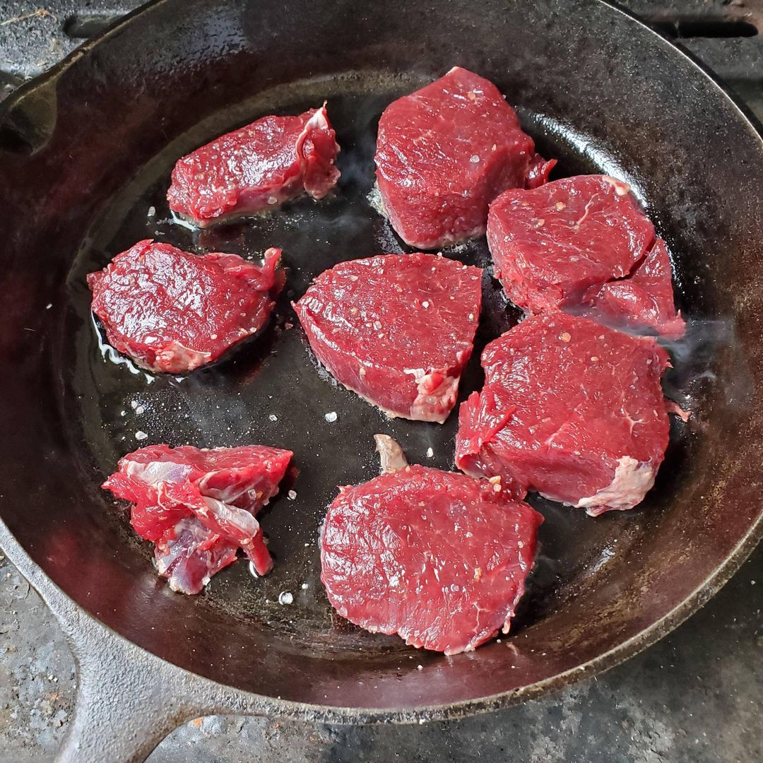 Venison backstrap on cast iron