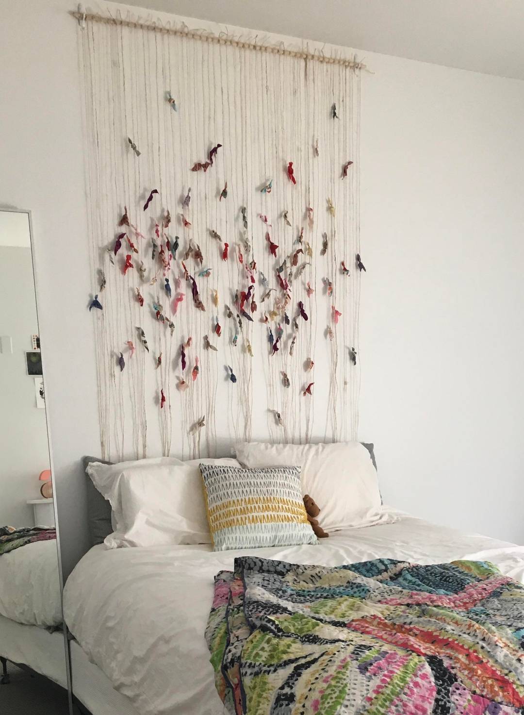 Wall art I made as a “headboard” for my first apartment. Twine and fabric scraps.