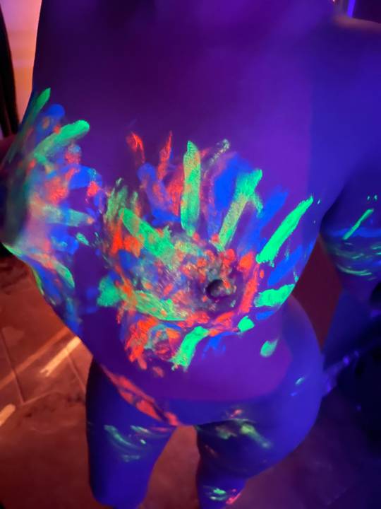 We went to a glow paint party last weekend. 3 sets of hands worked on her body. 🎨
