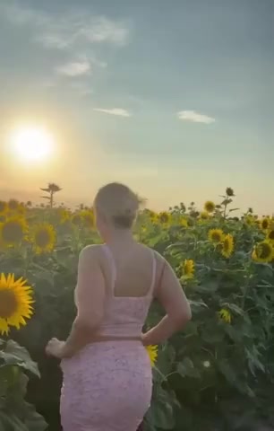 naked and horny in the sunflower field 