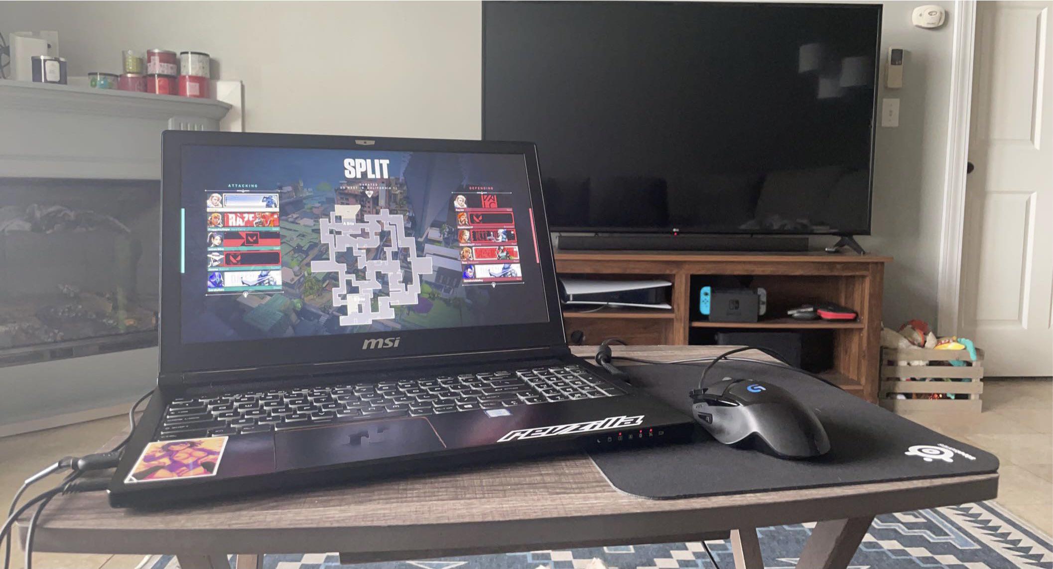 5 year old gaming laptop on a TV tray Scrolller