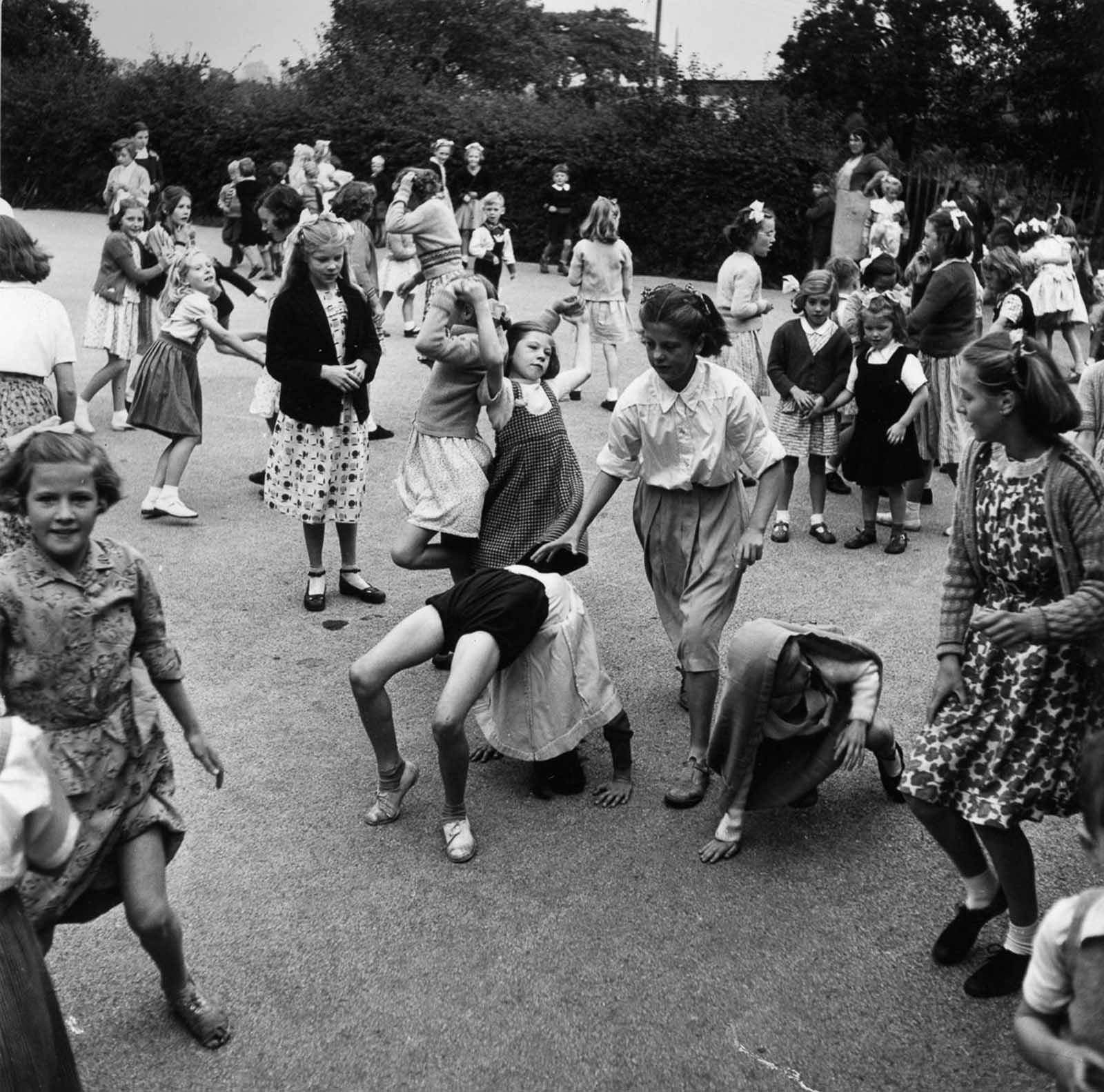 A crowd of schoolchildren in the playground of Walsgrave Colliery ...