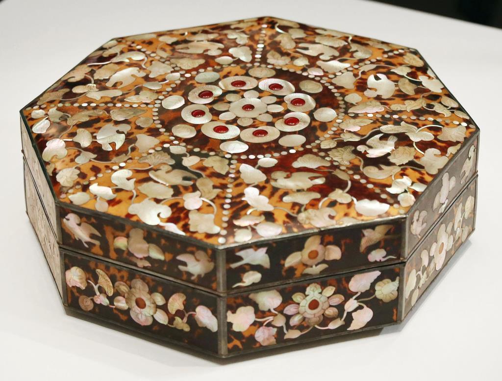 An octagonal box covered with tortoise shell and decorated with mother ...
