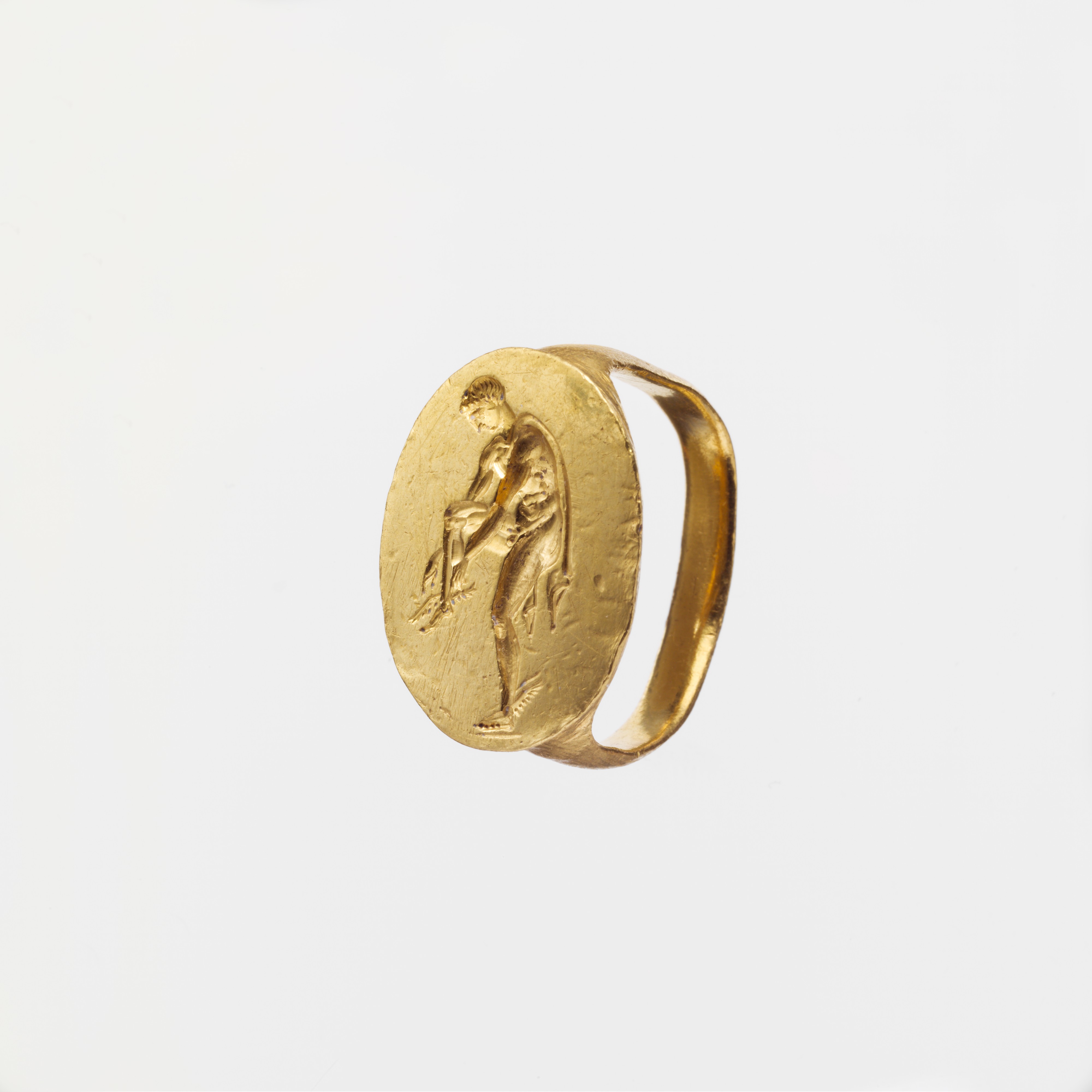 Ancient Roman gold finger ring featuring an engraved image of Hermes, c ...