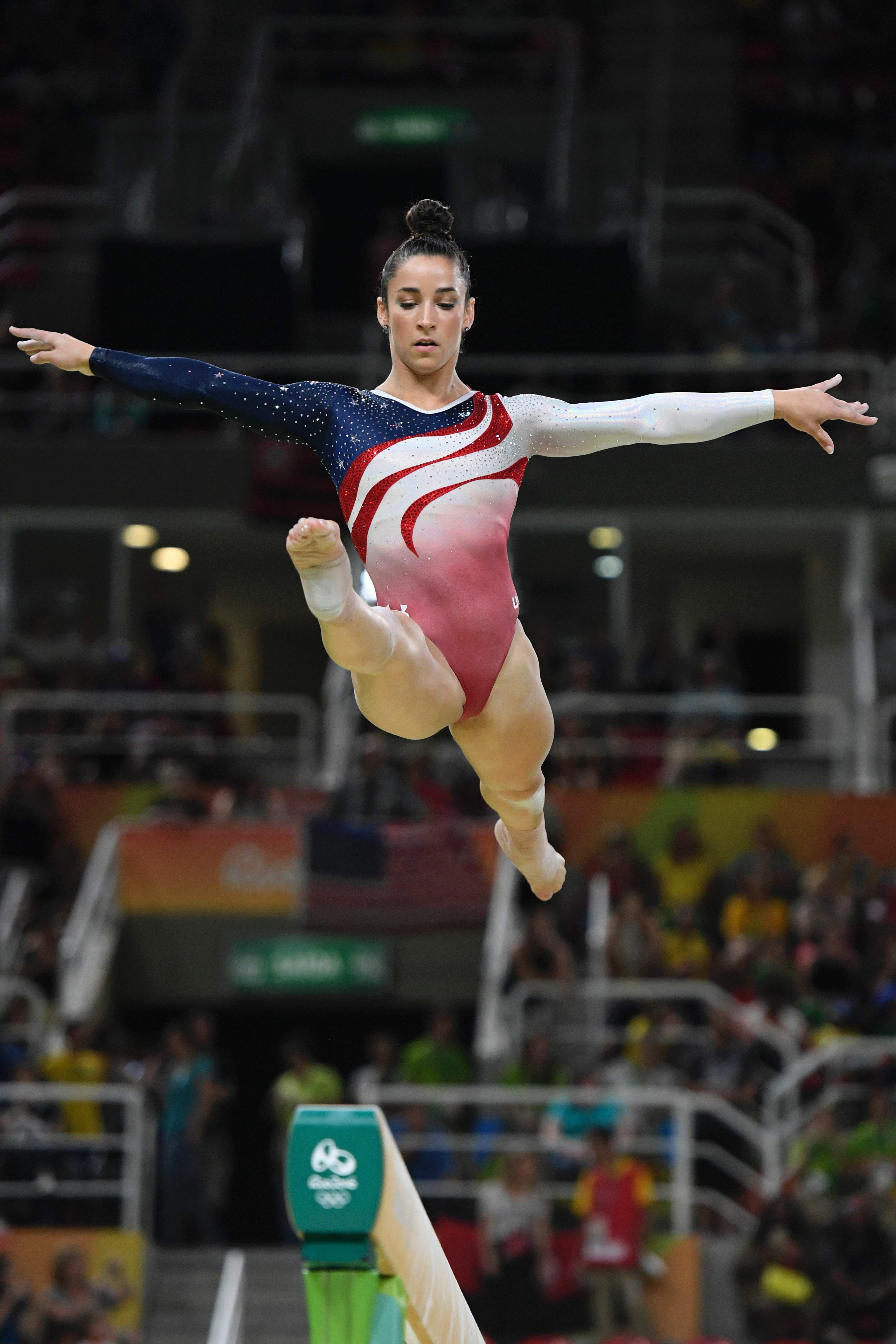 Artistic Gymnast Aly Raisman On The Balance Beam Scrolller