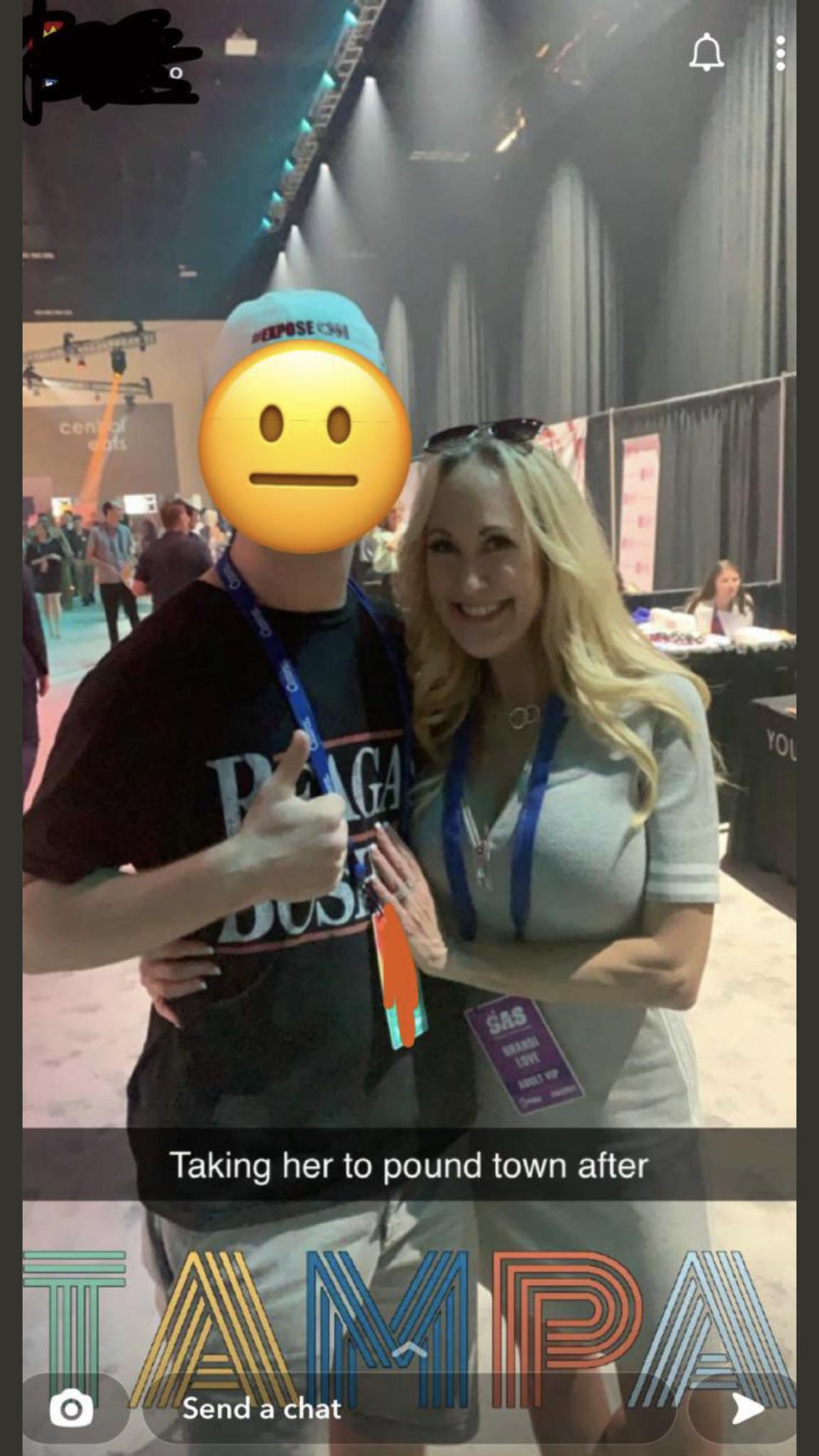 Brandi Love taking a picture with a young fan at a convention. Bet she