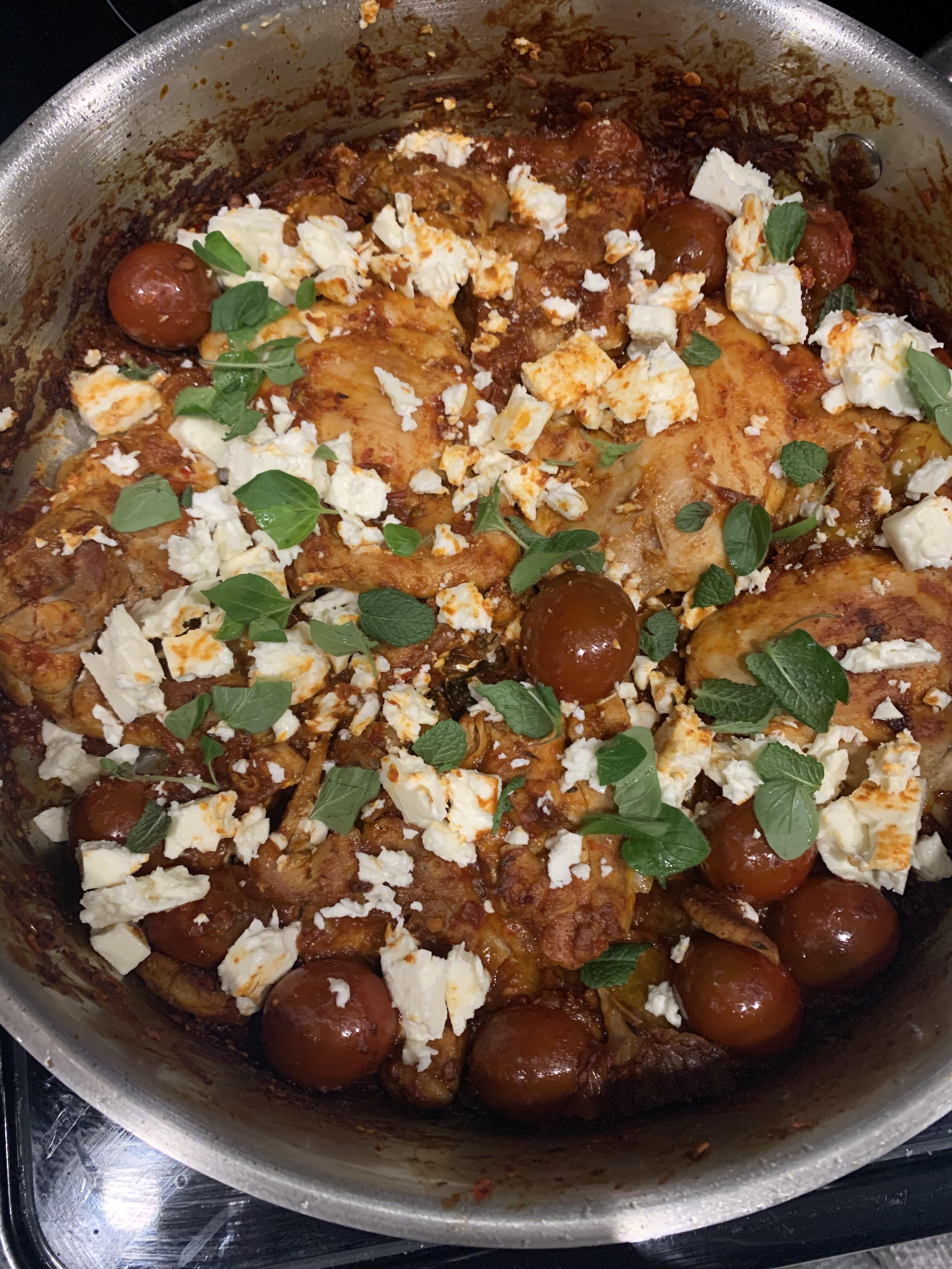 Chicken thighs with burst tomatoes, harissa, and feta Scrolller