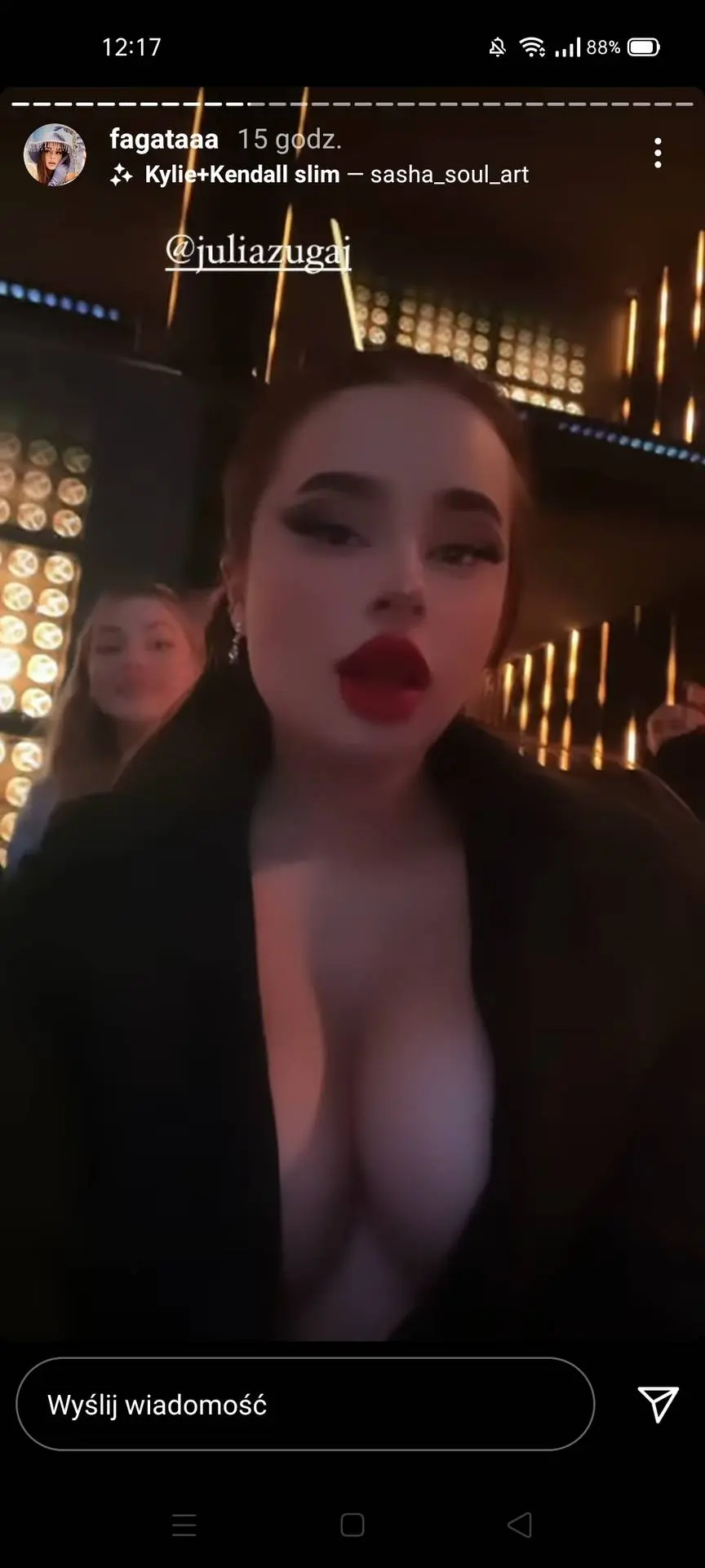 Julia Zugaj in a black blazer and red lipstick in a social media screenshot from r/SexyPolishYoutuber