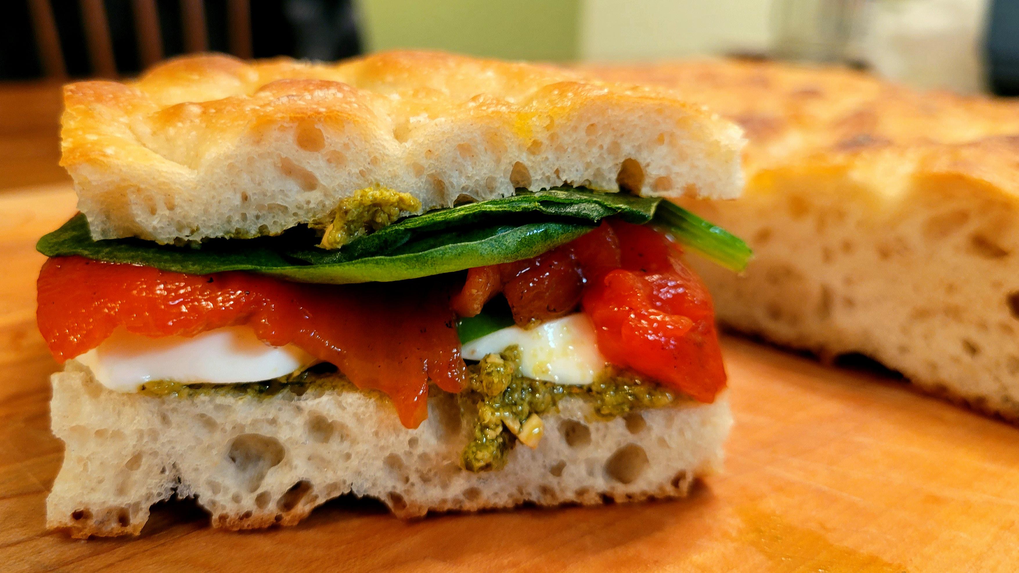 [Homemade] Focaccia with pesto, mozzarella, torn basil, roasted red