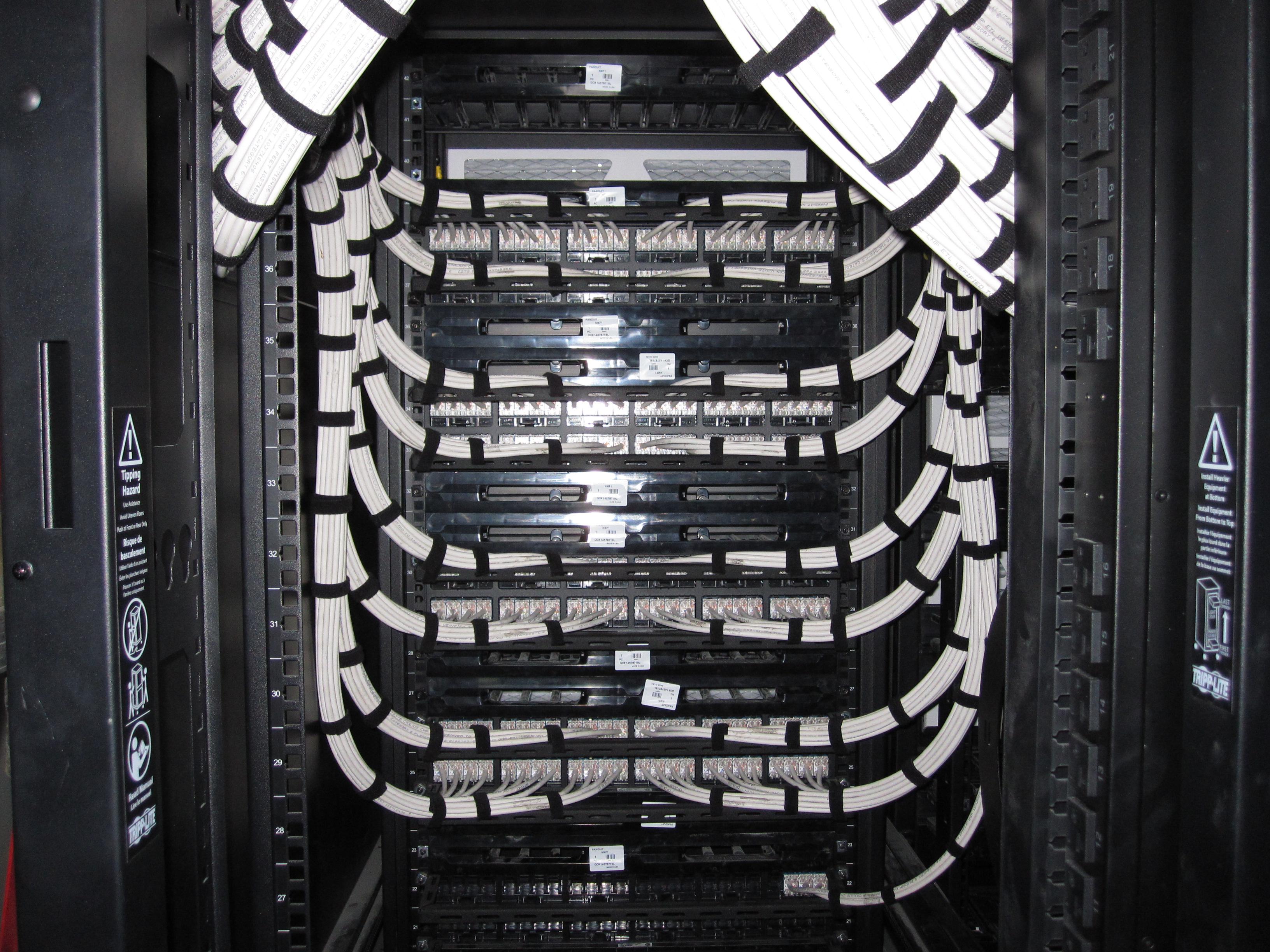 Inside one of our server racks with new cat6 cables. | Scrolller