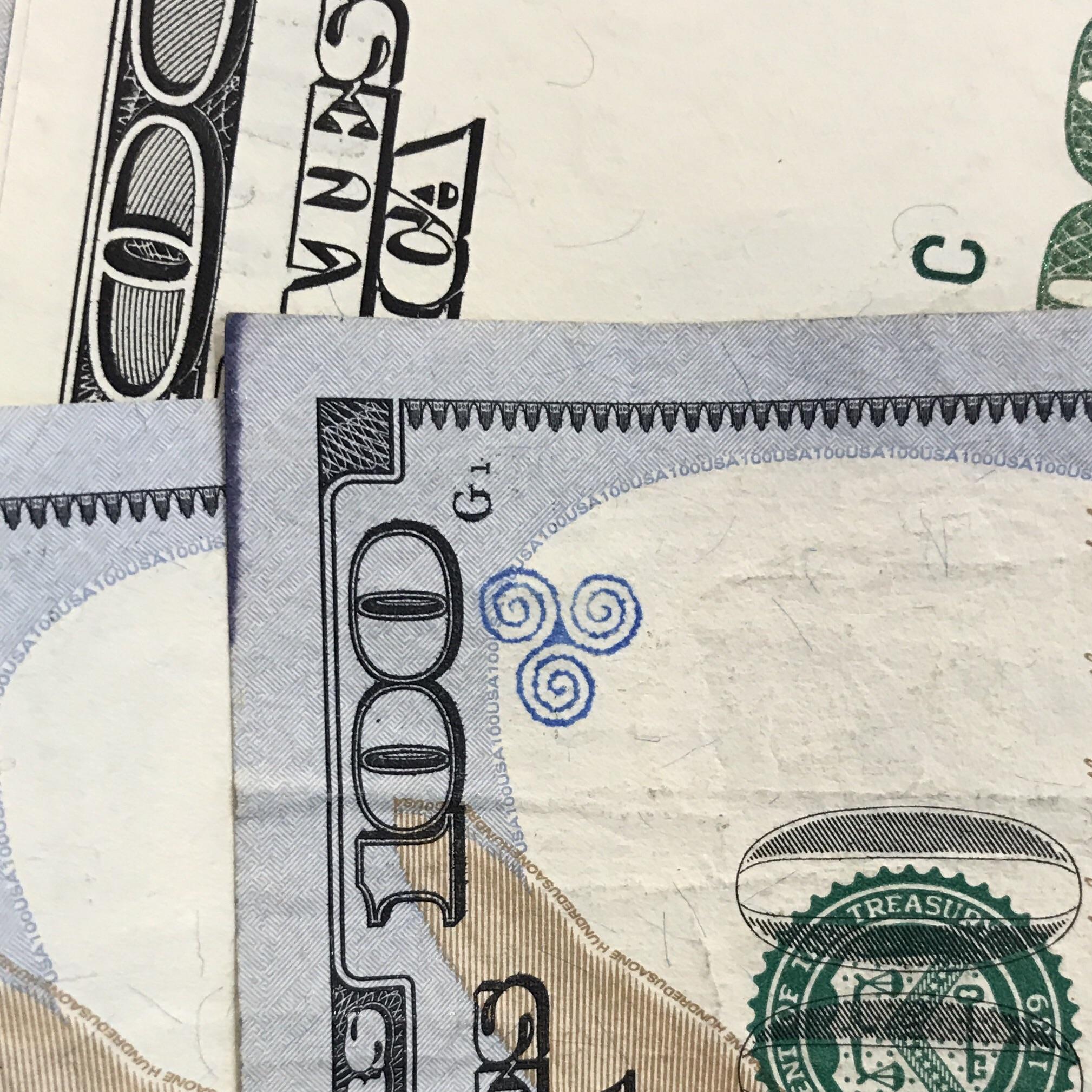 Interesting chop mark on US 100 bill. Scrolller