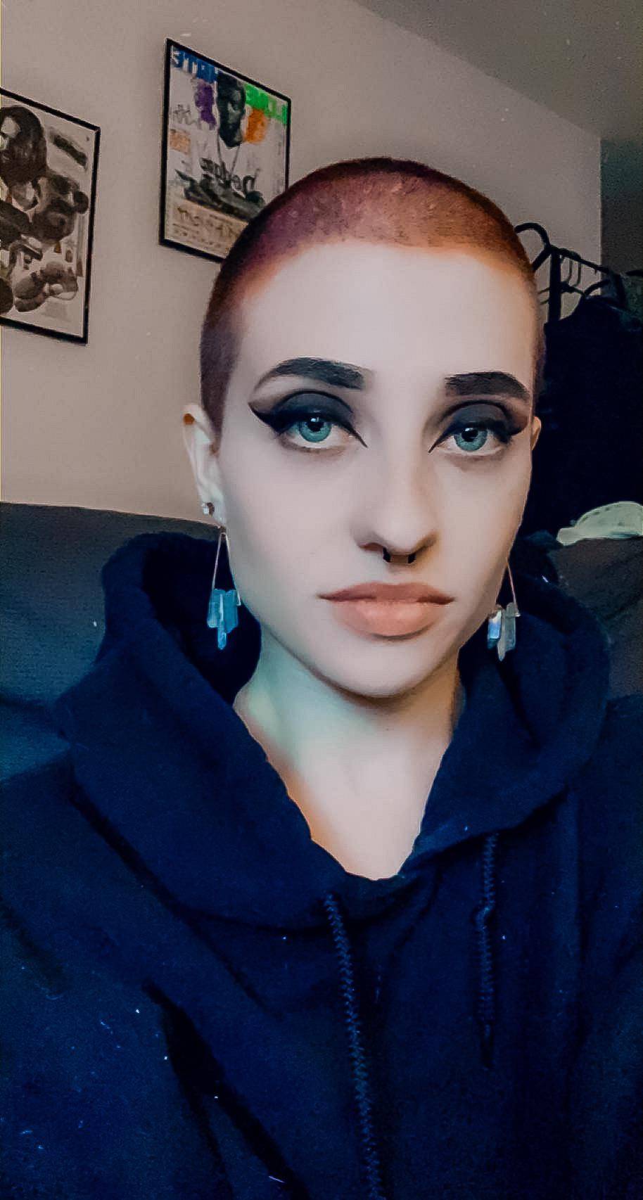 love-the-way-dangling-longer-earrings-look-with-a-buzz-scrolller
