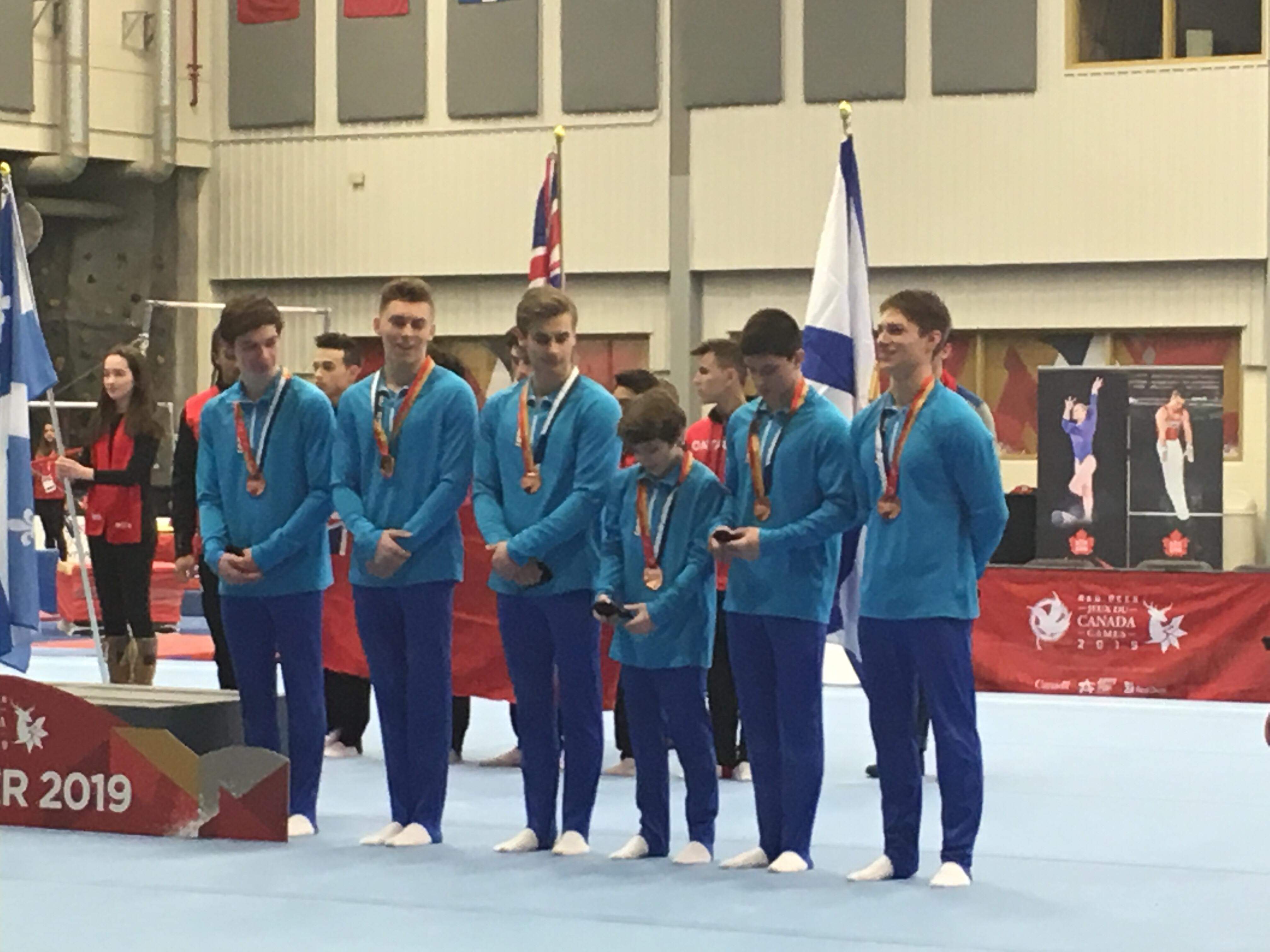 Men's gymnastic team picked up a medal! Scrolller