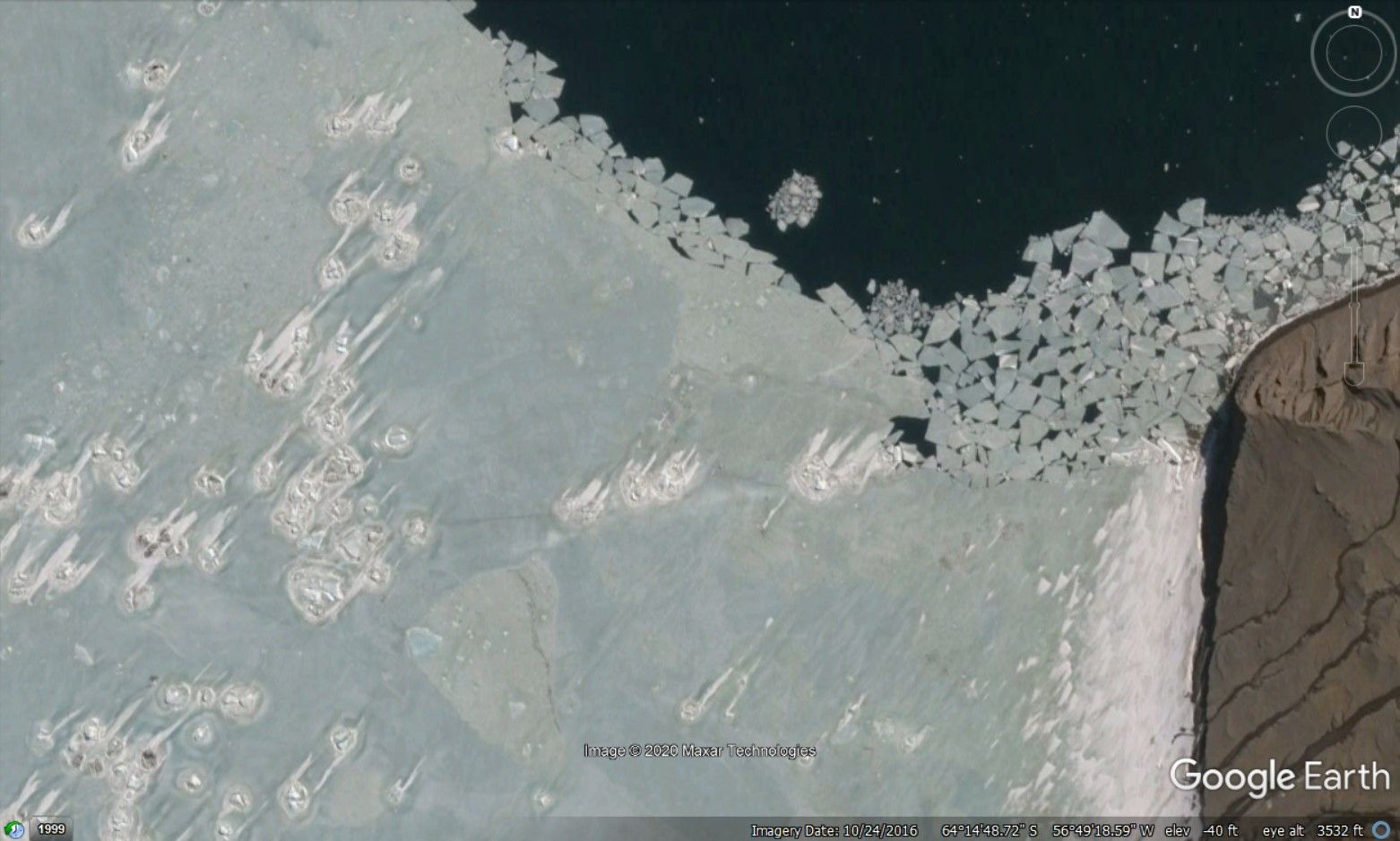 Moving icebergs leaving streaks as ice sheets formed around them. Or is