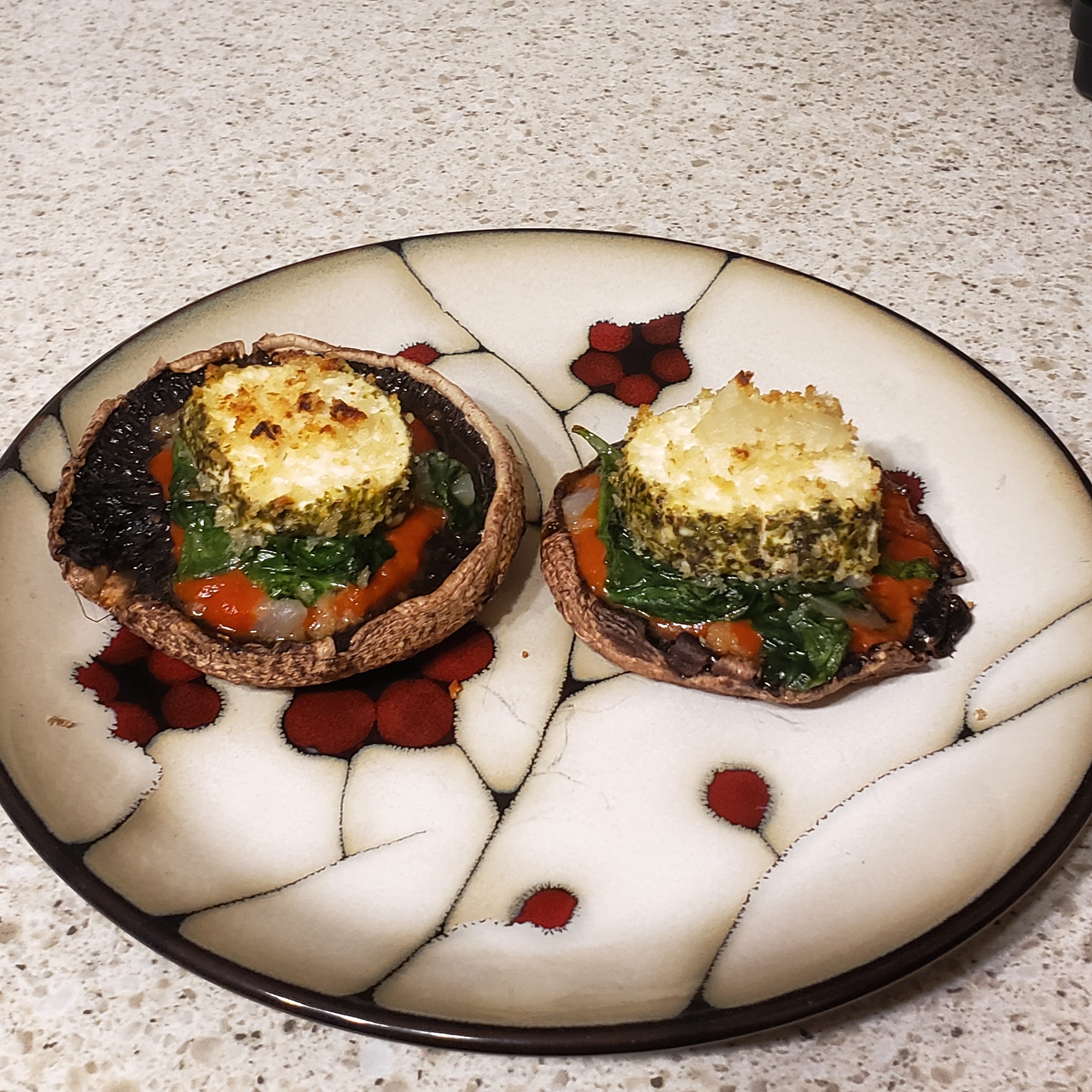 Roasted portobellos with marinara, sauteed spinach and goatcheese