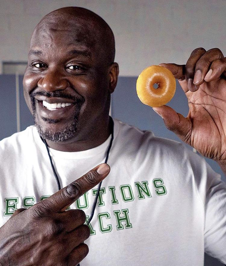 Shaq Holding A Full Size Donut Scrolller