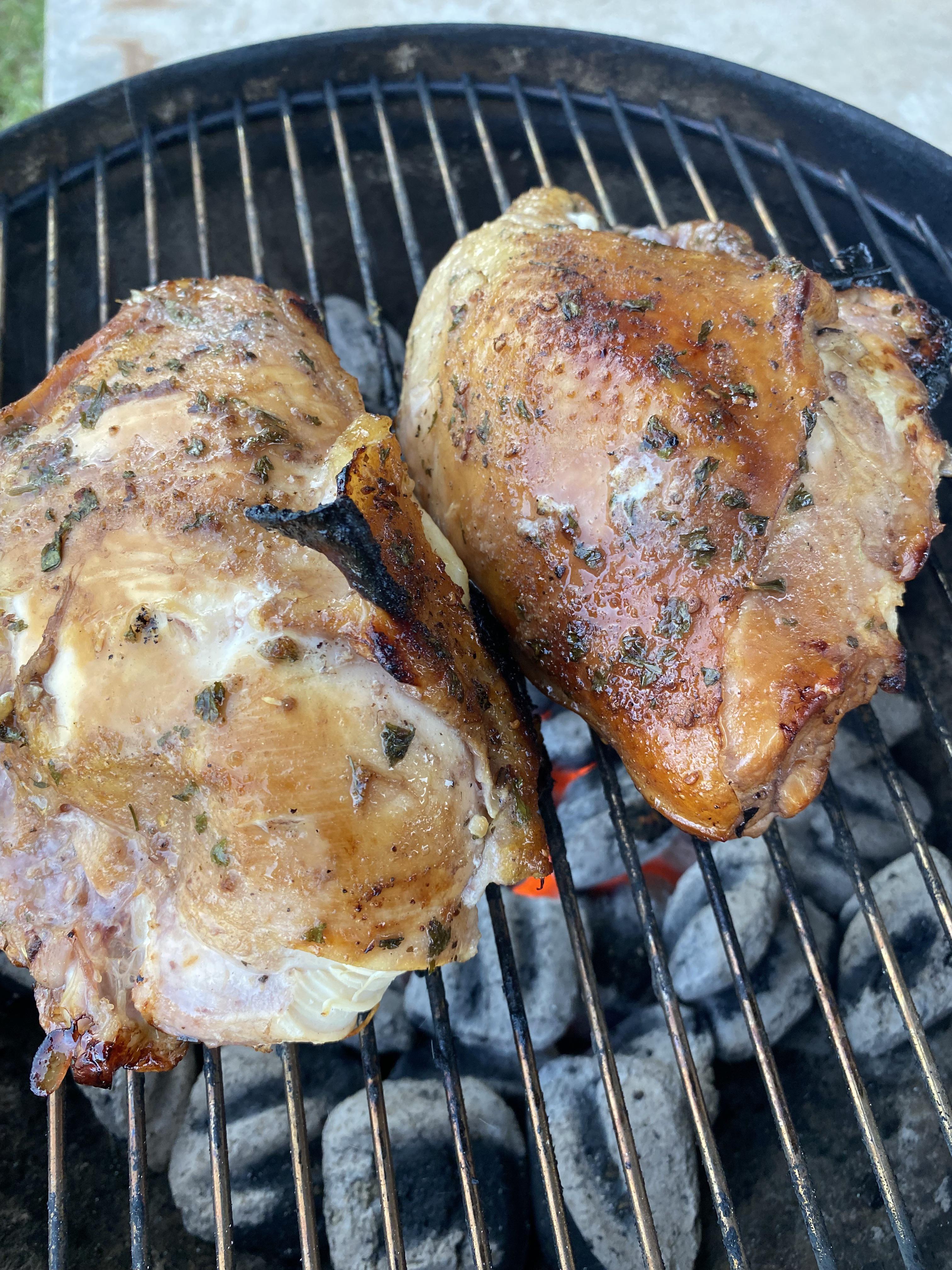 Split chicken breasts grilled over charcoal Scrolller