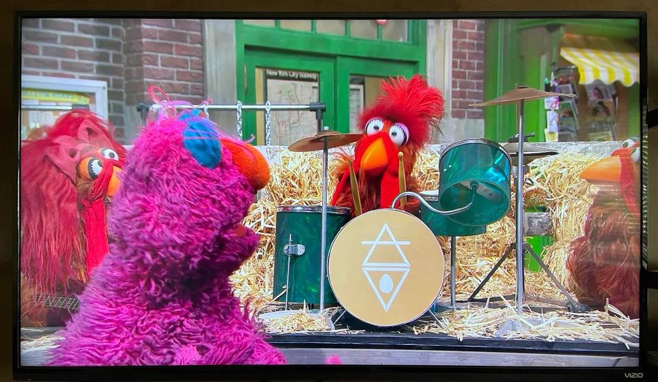 This chicken rock band on Sesame Street has a pretty fantastic logo ...