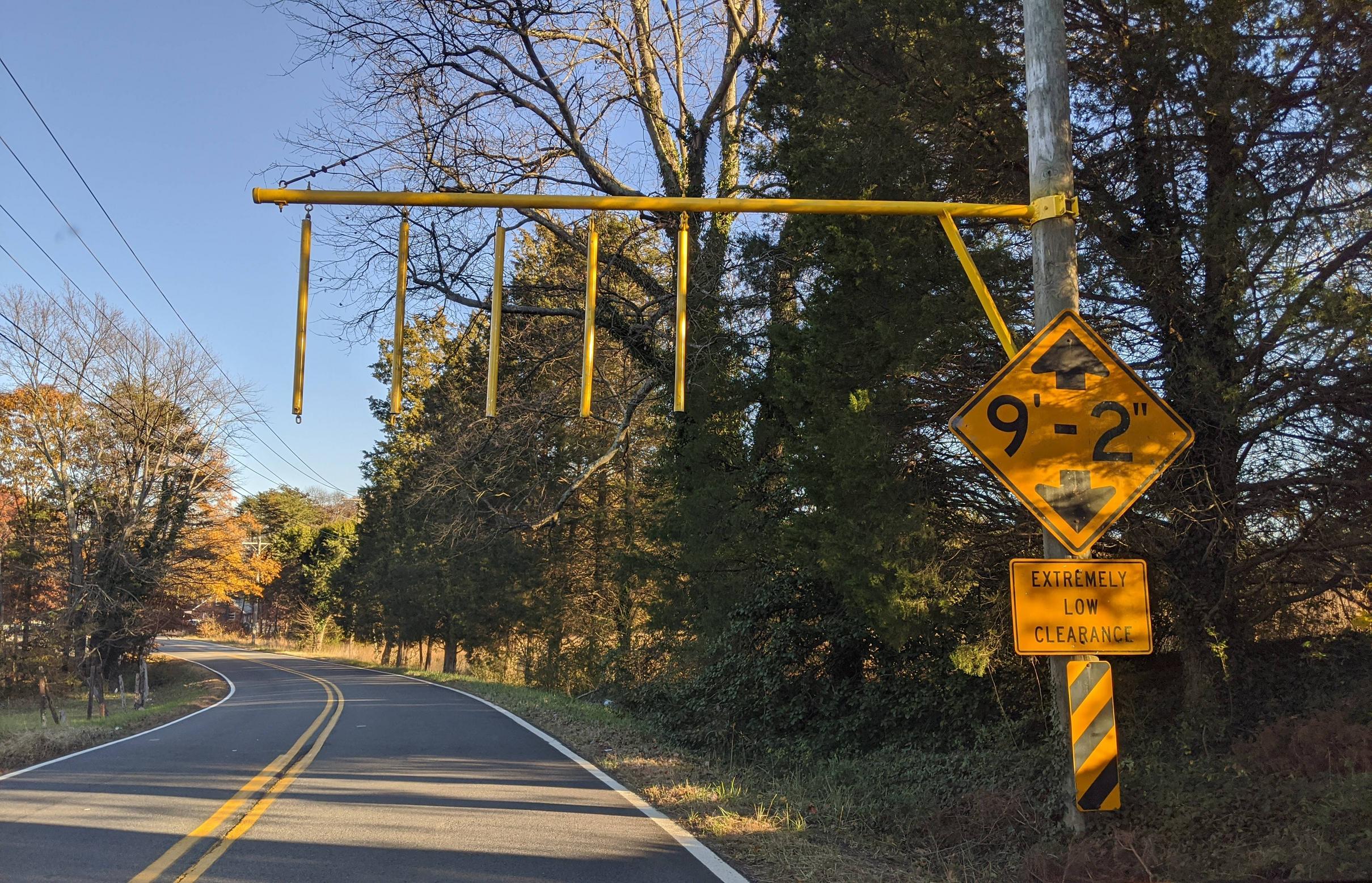 This low underpass uses hanging chains to rattle the roof as a warning ...