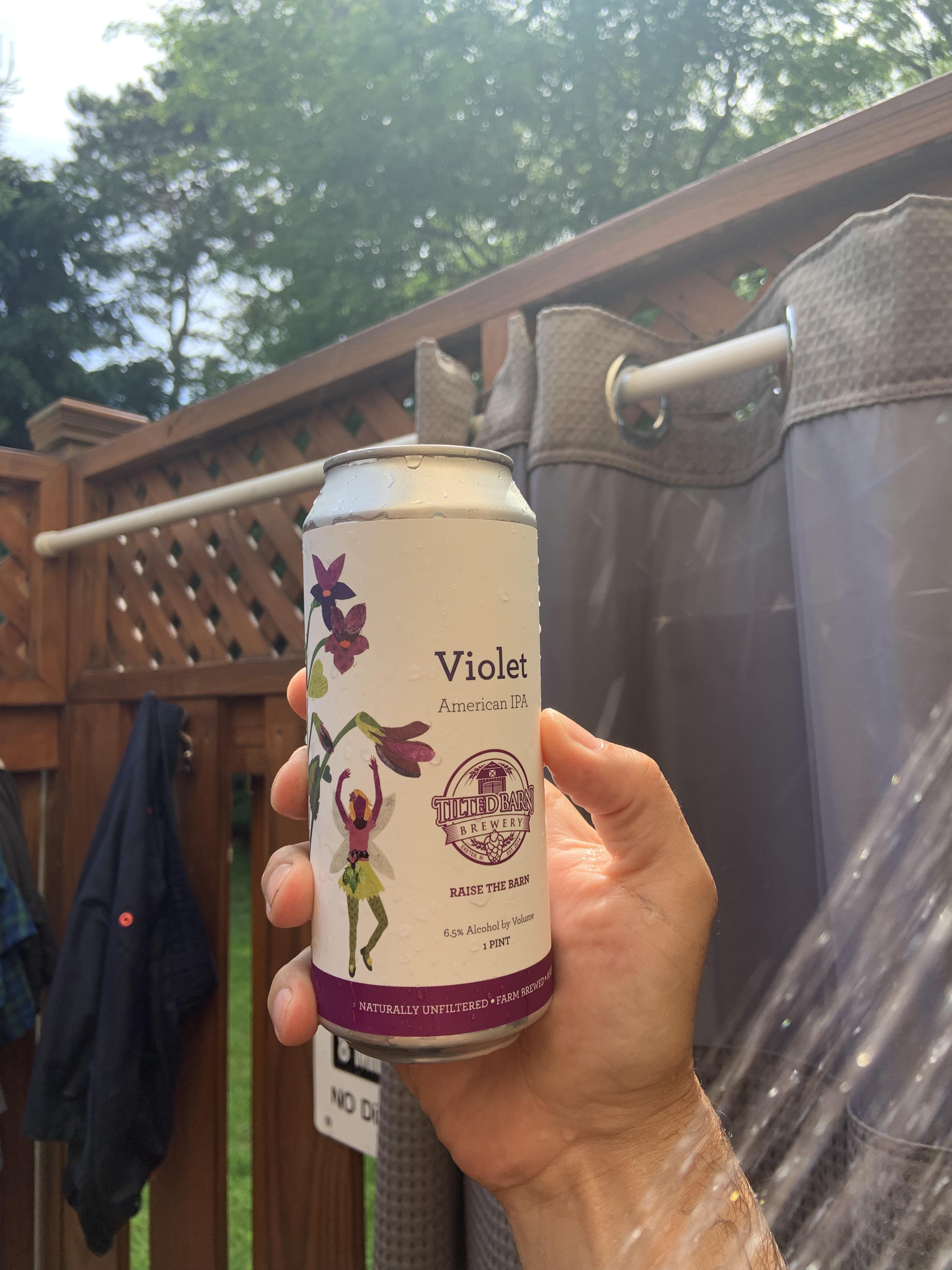 Tilted Barn Violet IPA in the outdoor shower after the beach