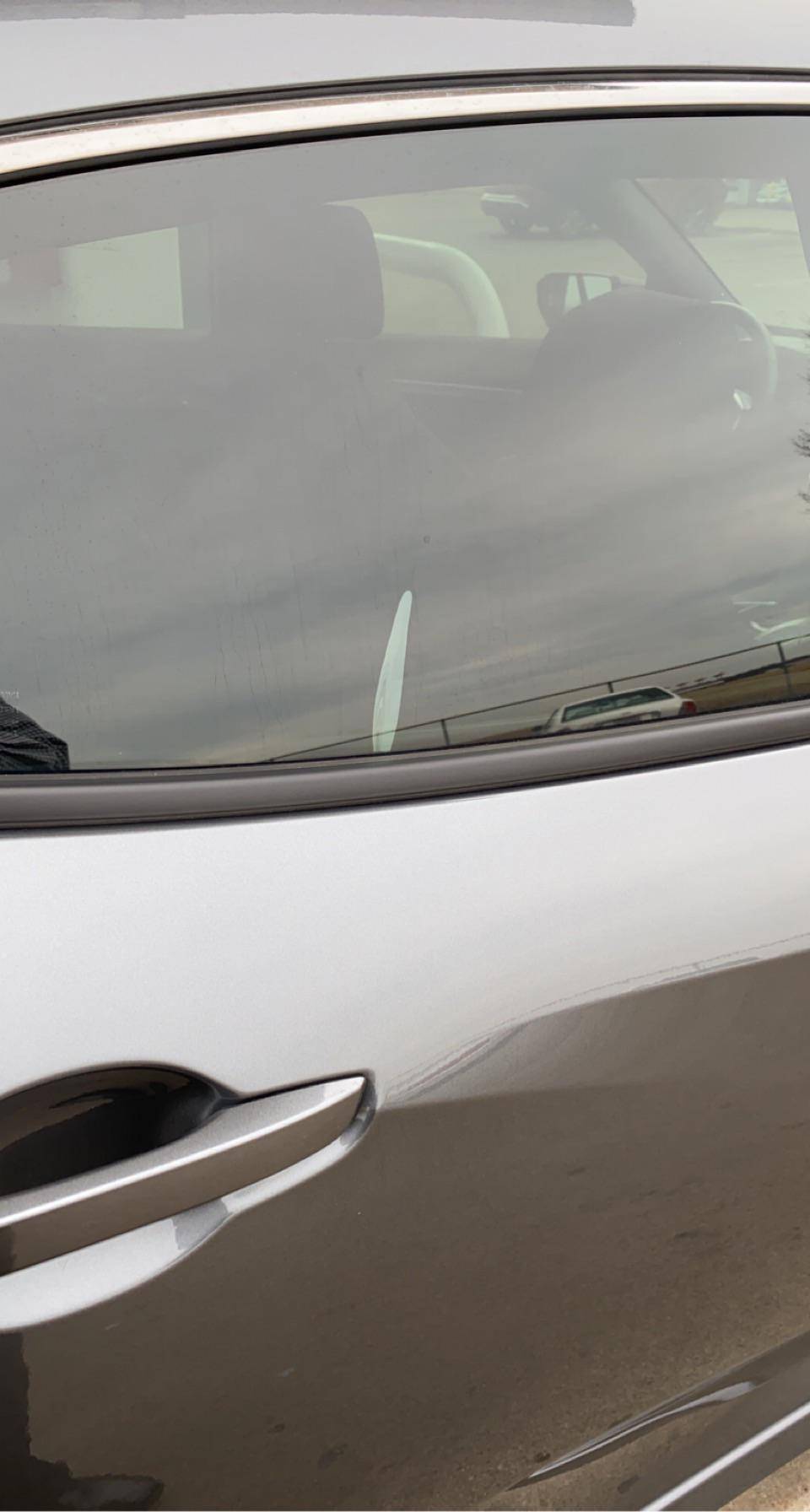 Tint gone wrong? I got my windows tinted yesterday and they said bubbling is normal for a couple