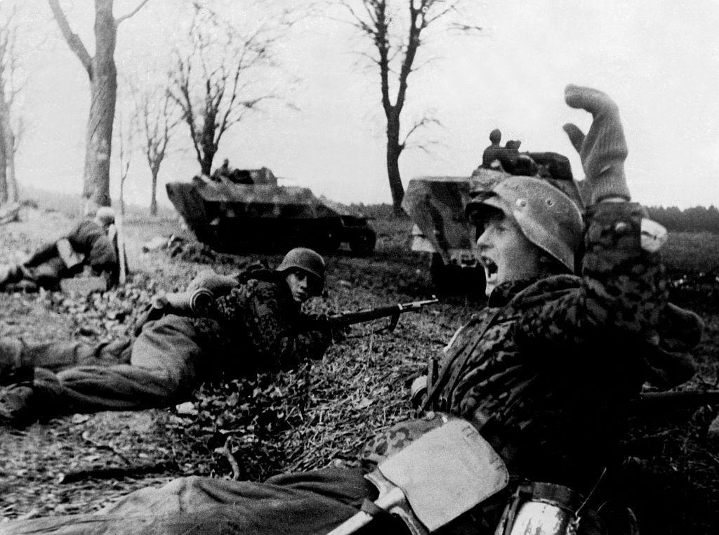 Waffen-SS halftracks and infantrymen starting a counter-attack ...