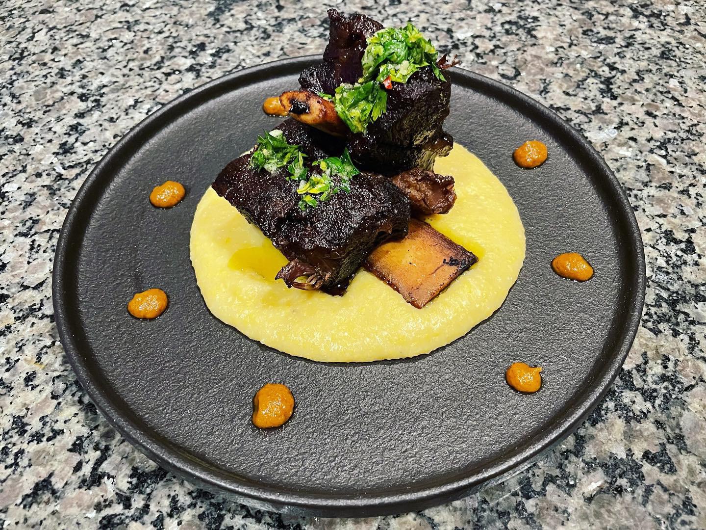 Wine Braised Short Ribs over an amazing Creamy Polenta, topped with a