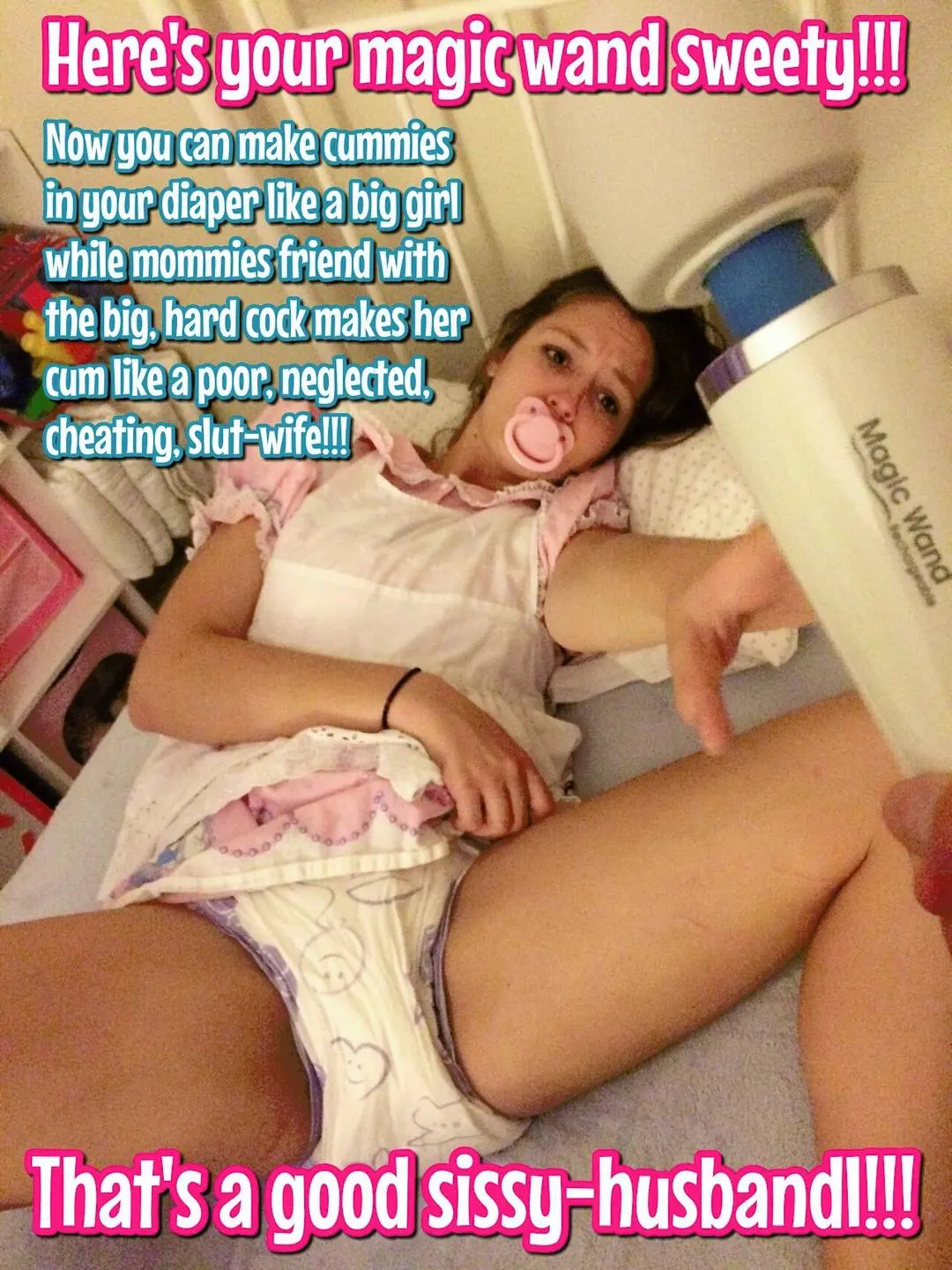 Femboy in a pink frilly dress, adult diaper, and pacifier with a Magic Wand massager