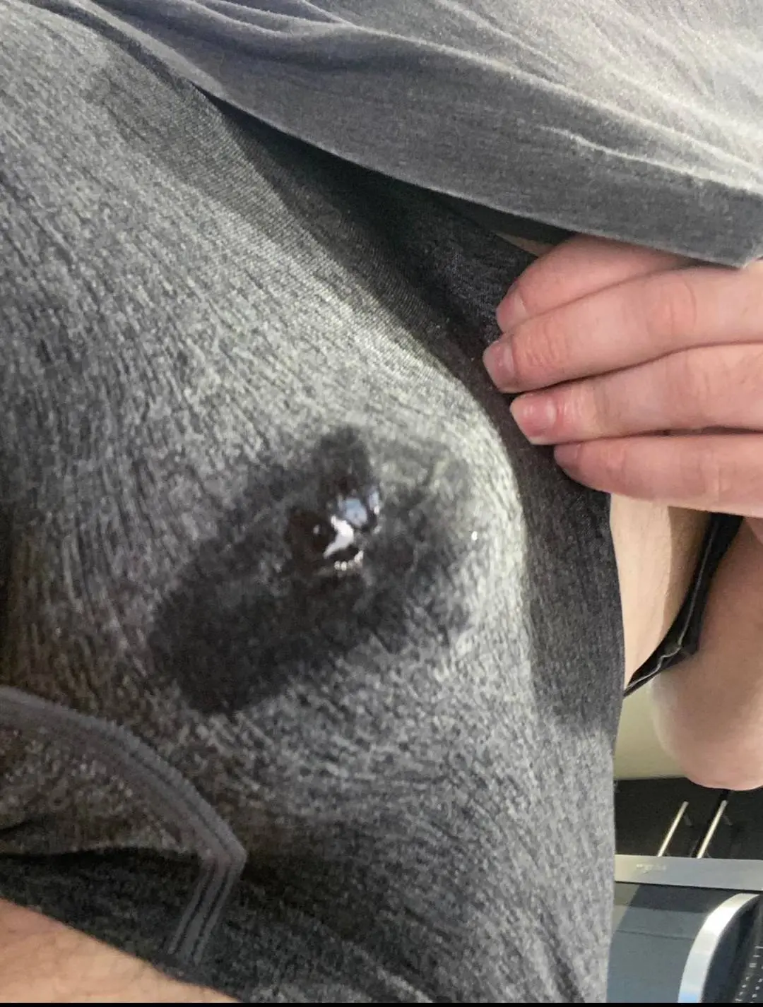 Sissy chastity wet spot on grey underwear, close-up of a white man leaking precum.