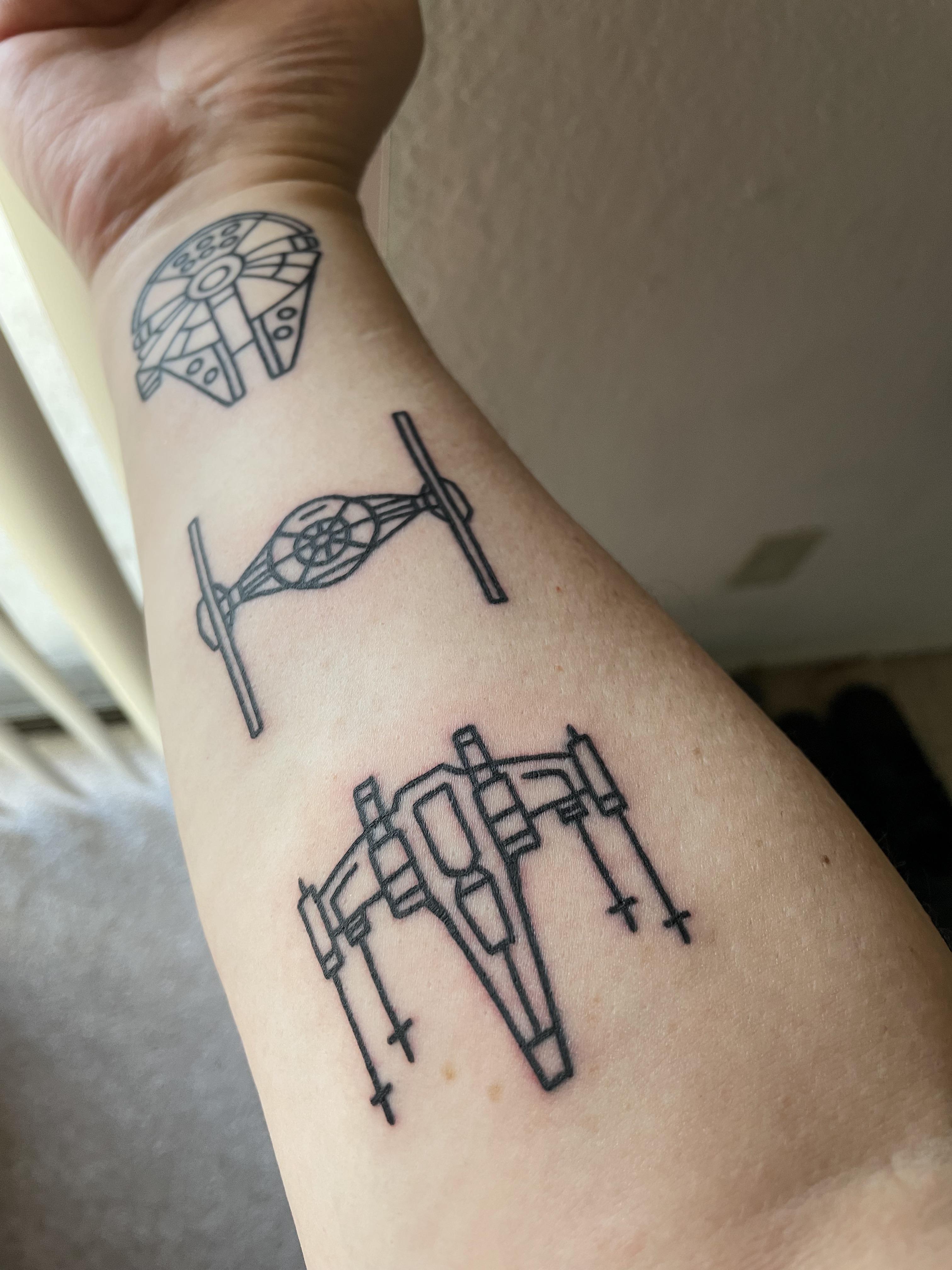 Minimalist Princess Leia tattoo on the forearm
