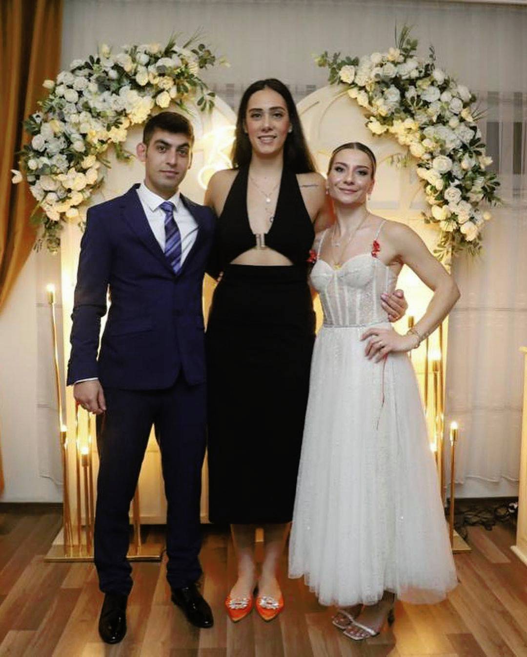 taller than bride and groom | Scrolller