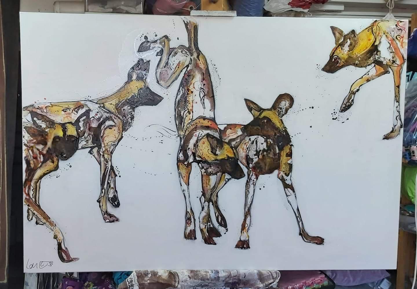 African painted wolves by Louise Shotter | Scrolller