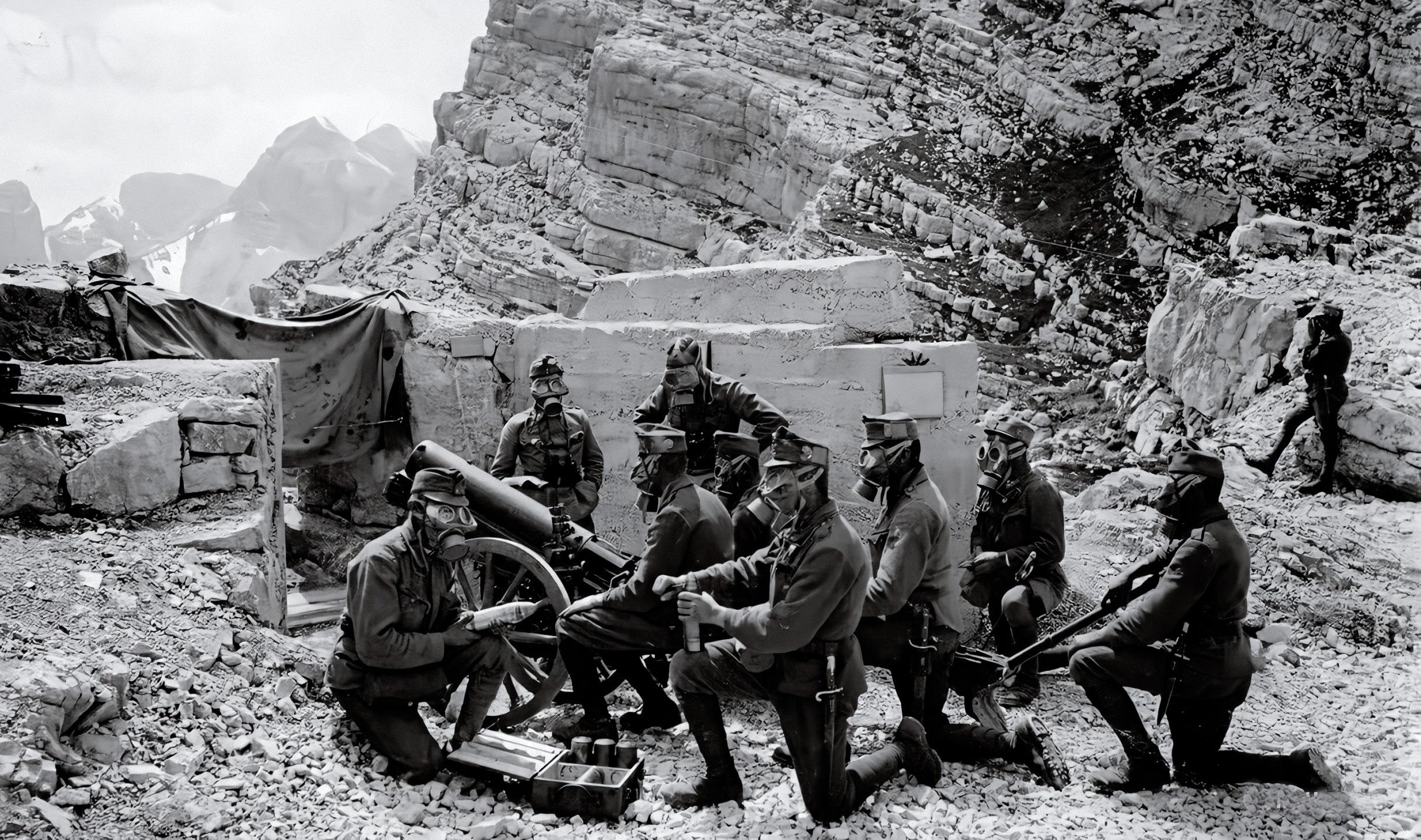 Austrian Skoda 75 mm mountain gun and its crew with gas masks on ...