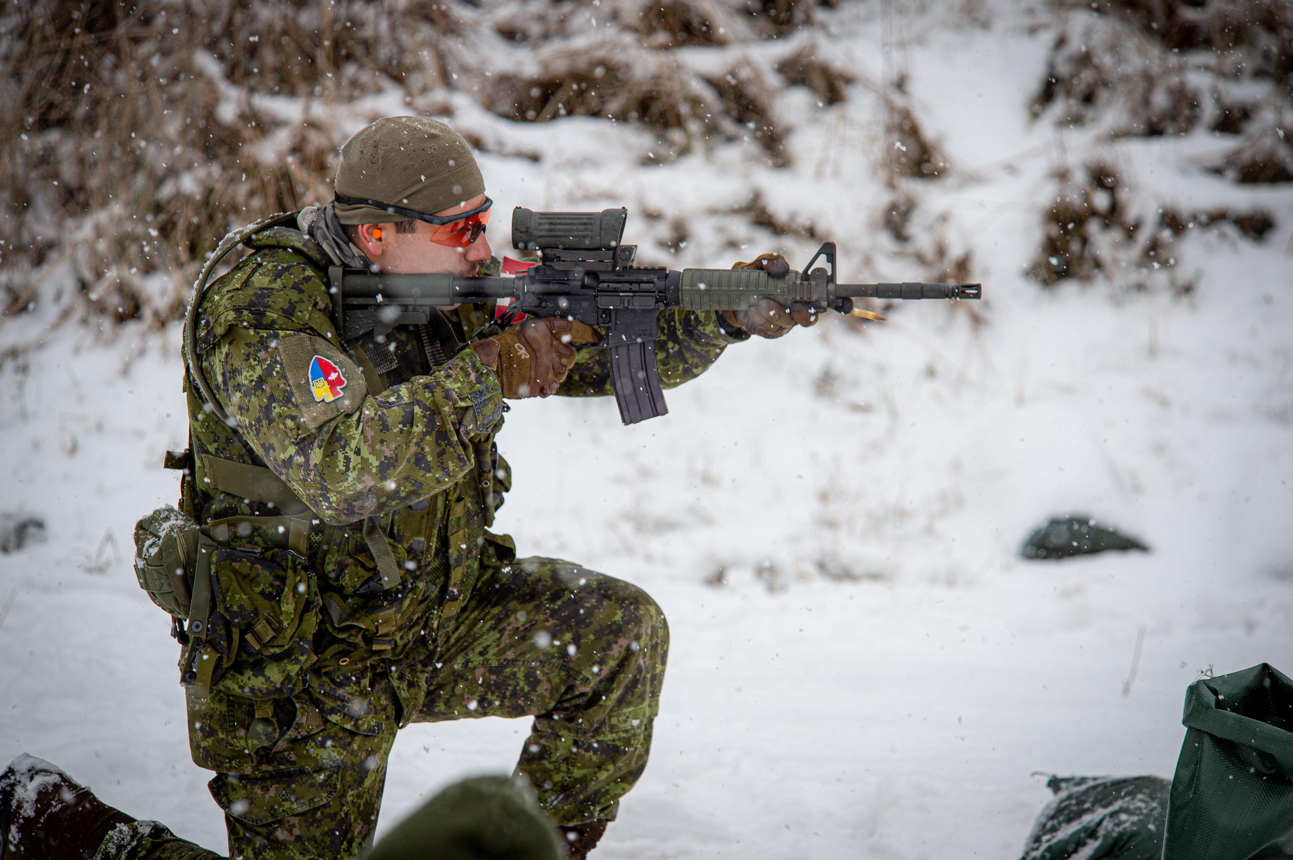 Canadian Forces member taking part in a C8 Carbine live-fire range 2021 ...