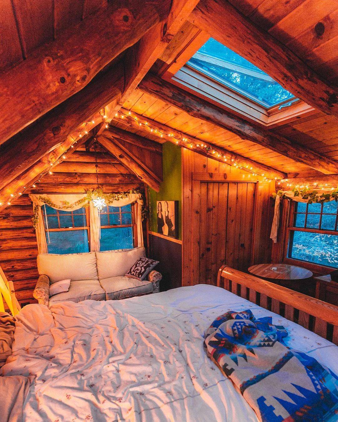 cozy-cabin-bedroom-with-a-skylight-for-stargazing-scrolller