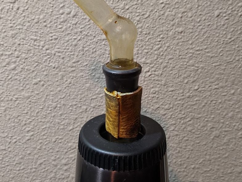 Cut the finger off an old leather glove and slid it over the bowl piece