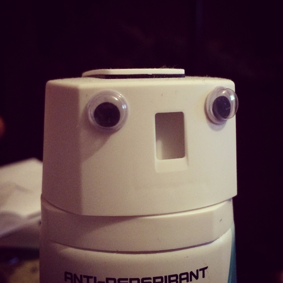 Deodorant can + googly eyes = robot Scrolller