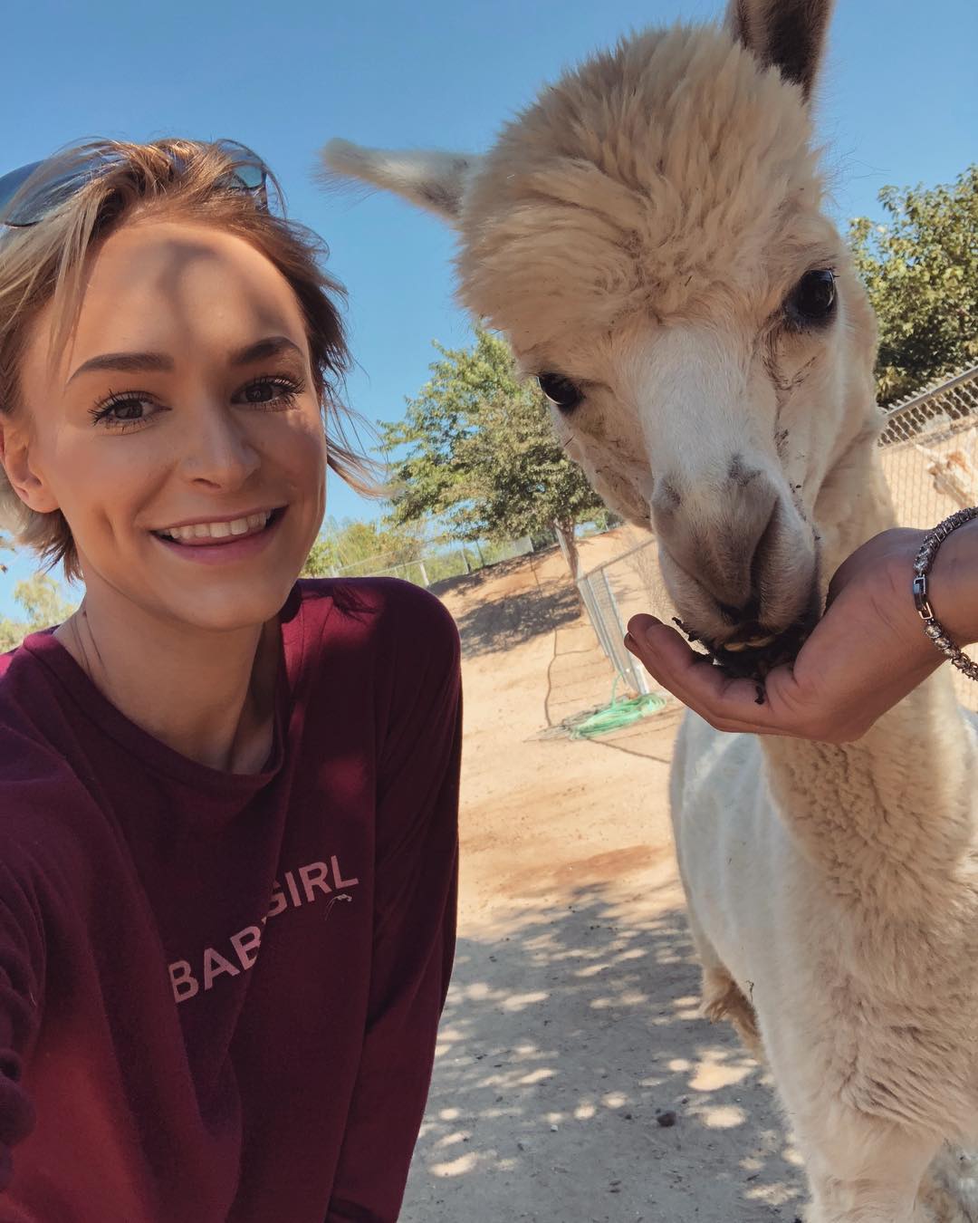 Emma Hix, with llama | Scrolller