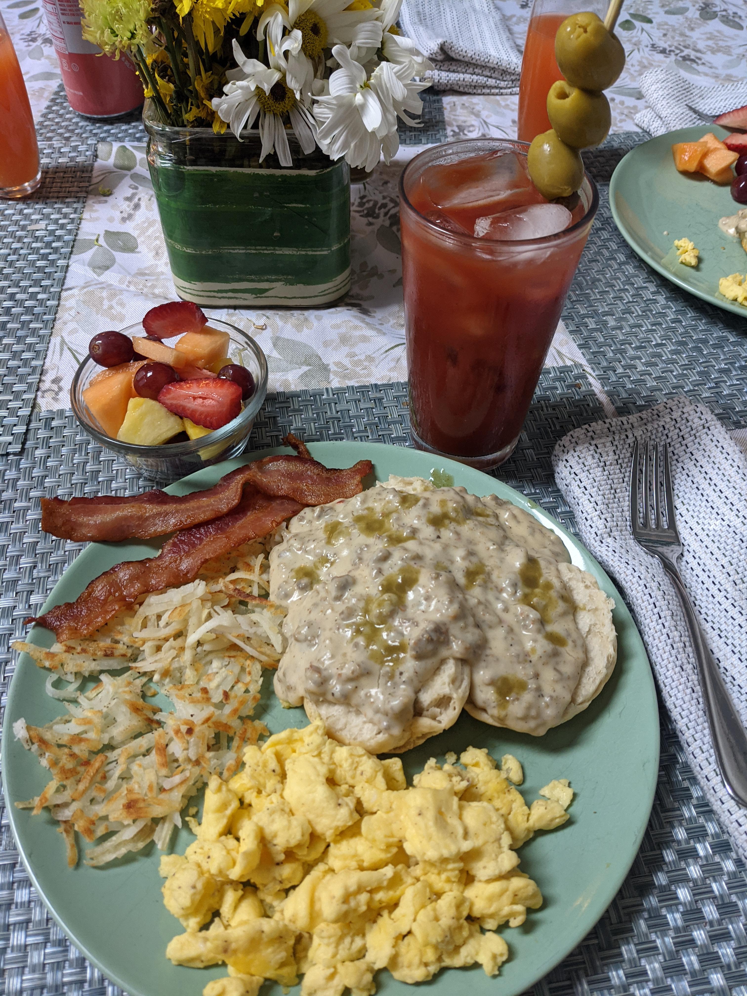 [homemade] sausage gravy from scratch on biscuits, with scrambled eggs