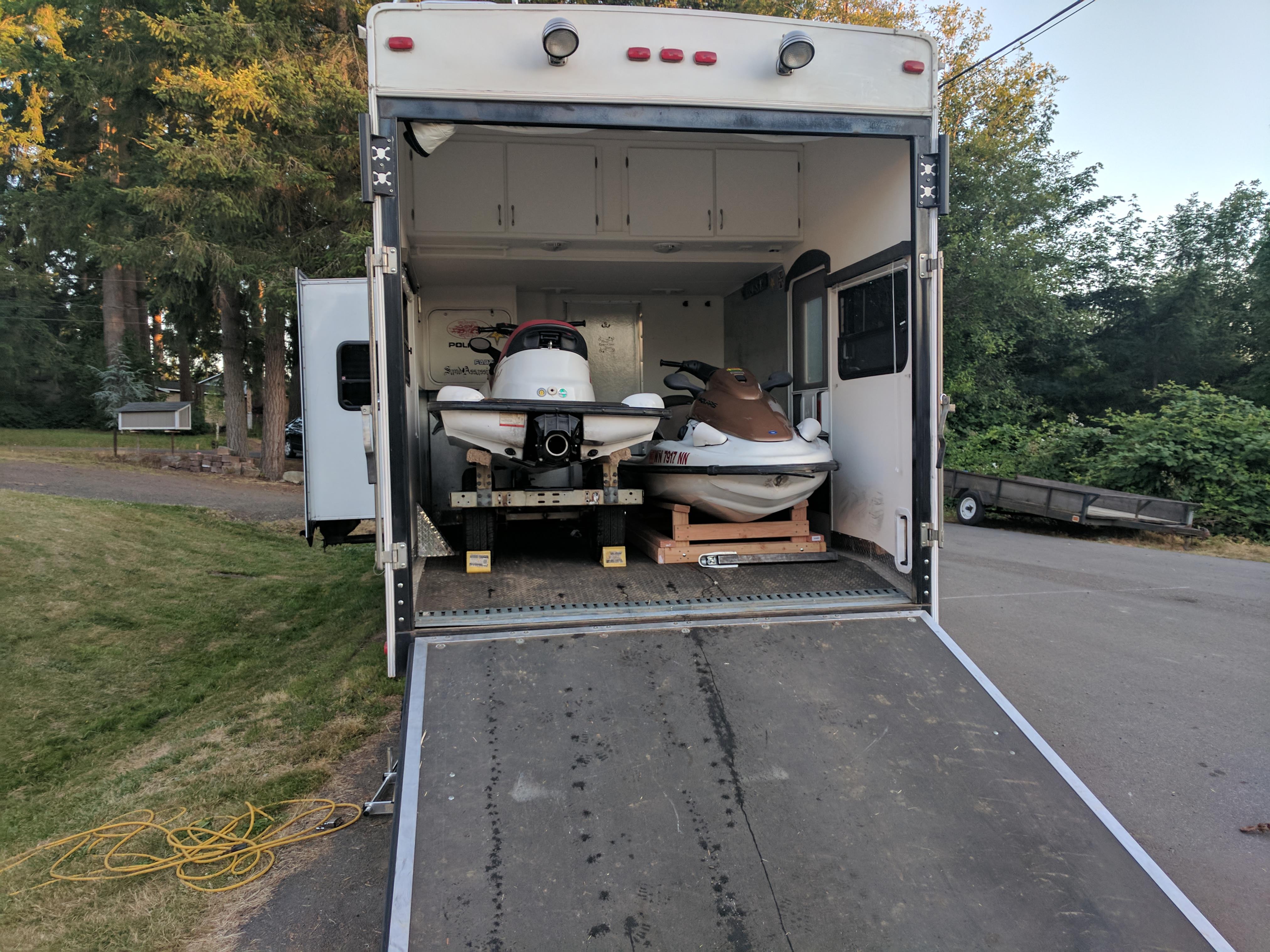 Loading two 3 seat jet skis into a toy hauler rv Scrolller