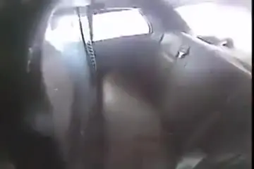 Man enters the rear of a police vehicle and attempts to cuff himself ...