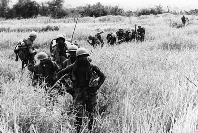 Marines of the 5th Marine Regiment move forward on a sweep through ...