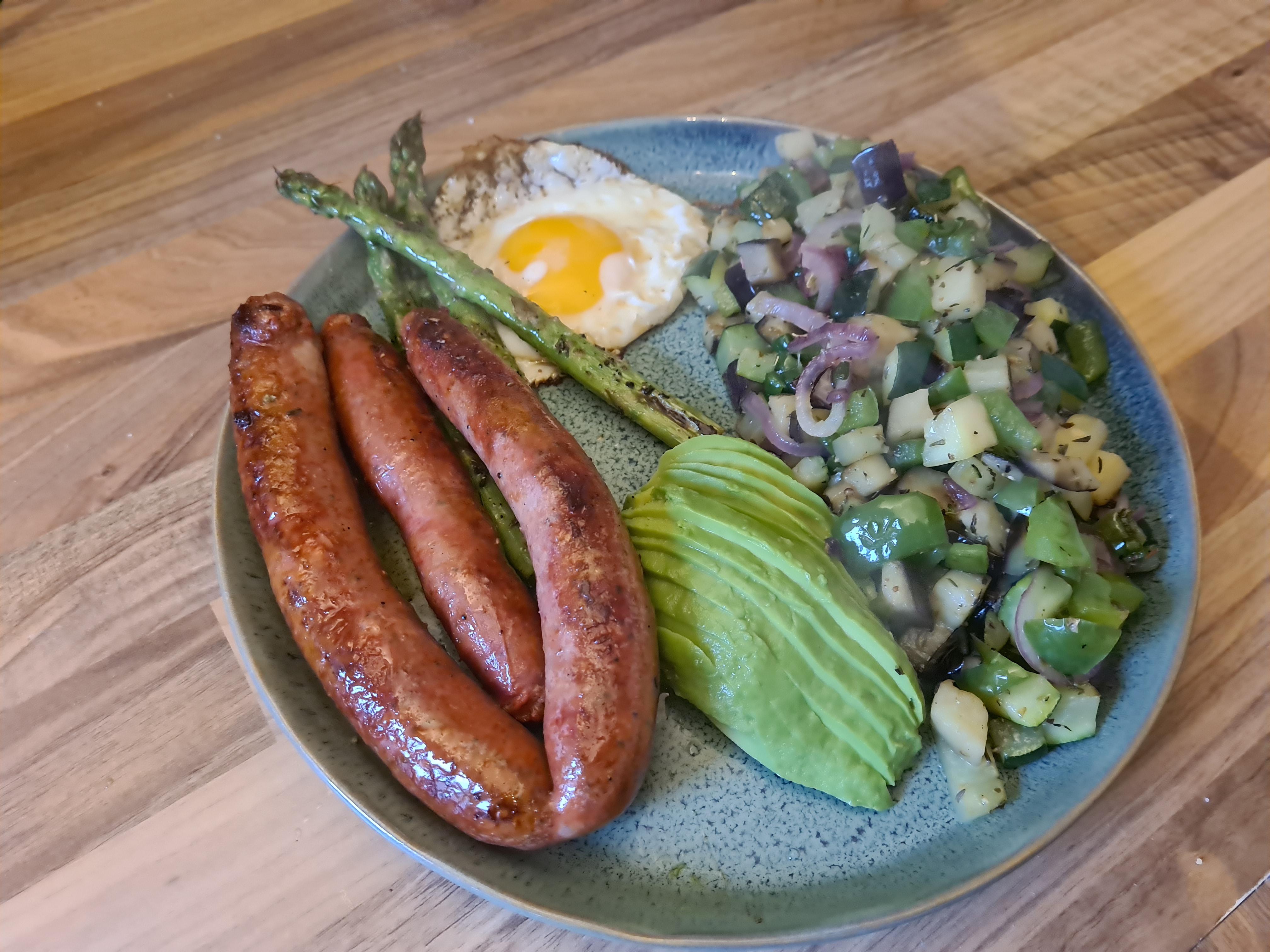 Merguez Sausage With Green Vegetables And A Egg Scrolller