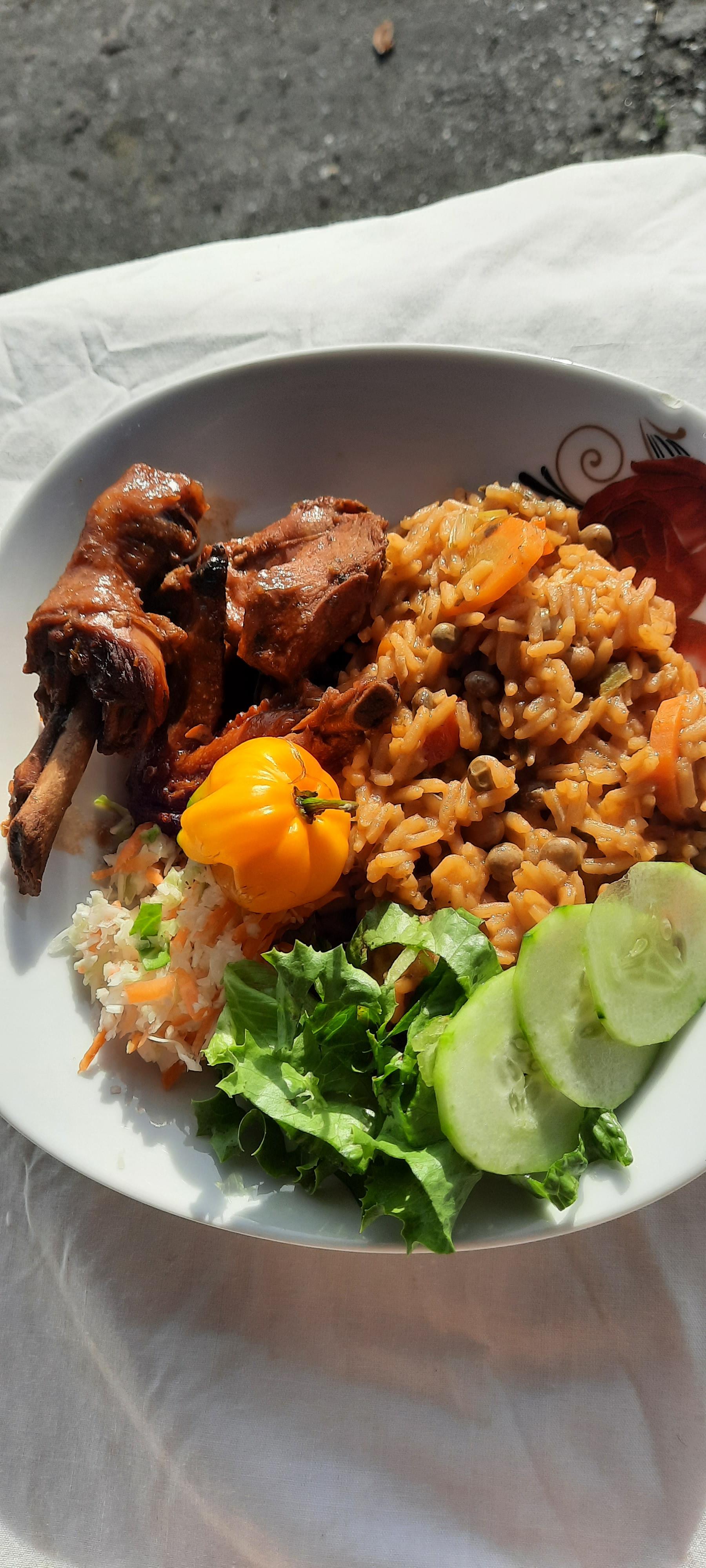 Peas and rice, stewed chicken with coleslaw, cucumbers and scotch ...